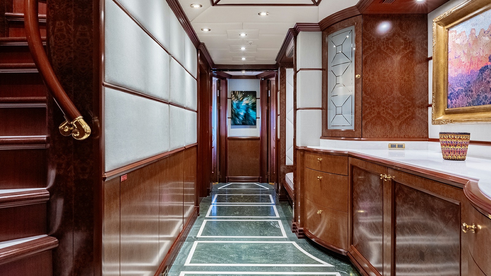 a long hallway with a glass door aboard IRON BLONDE Yacht for Charter