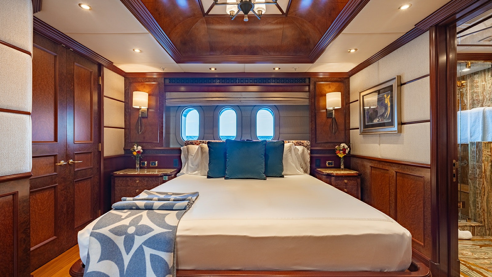a bedroom with a large bed aboard IRON BLONDE Yacht for Charter
