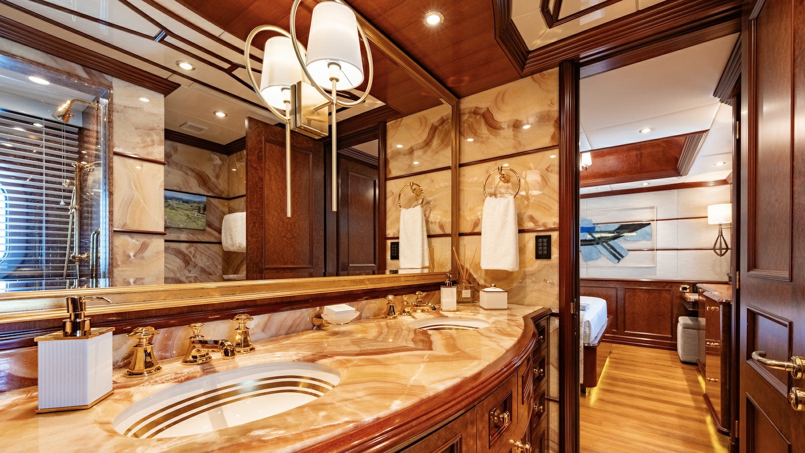a bathroom with a large mirror aboard IRON BLONDE Yacht for Charter