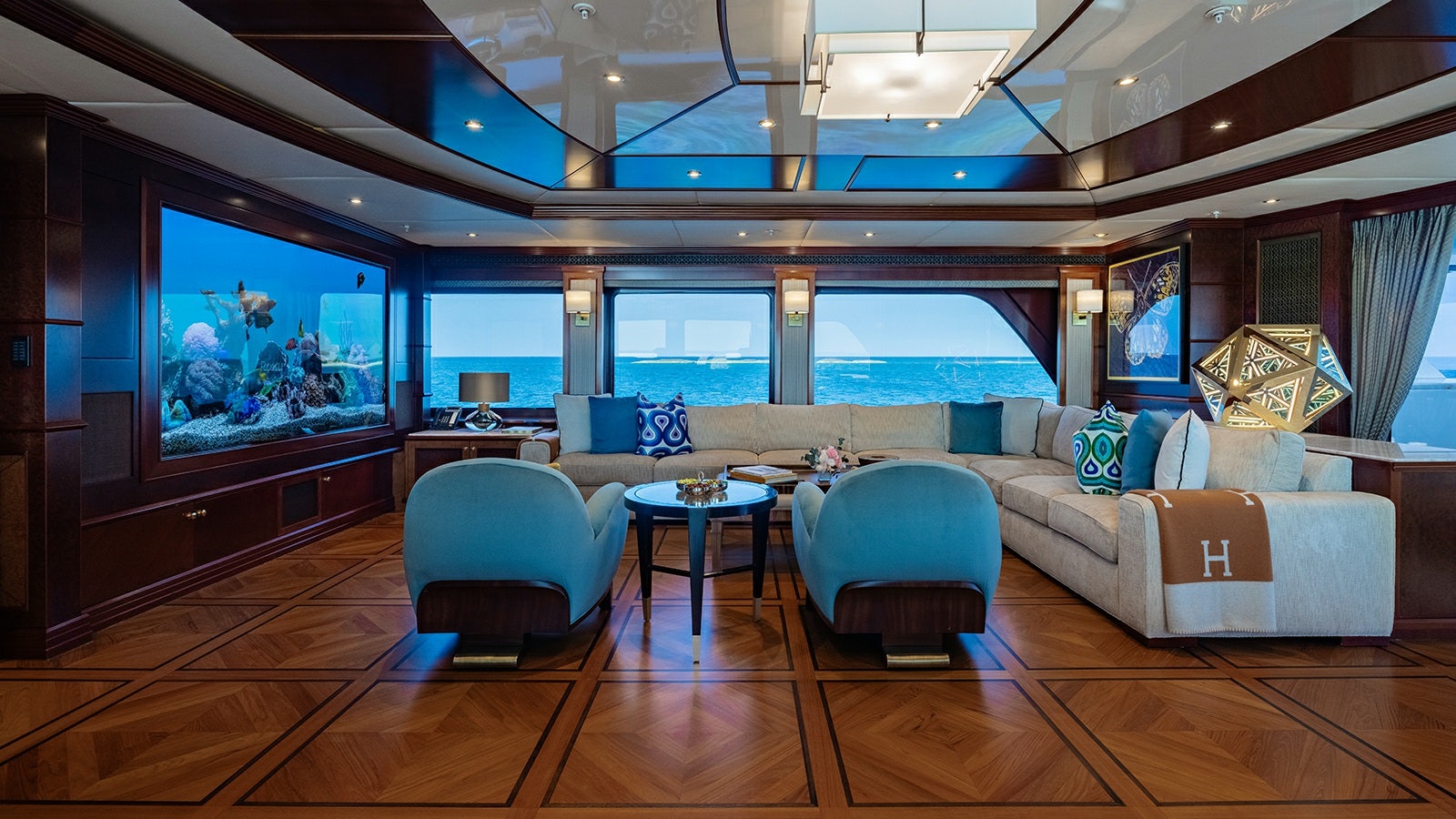 a room with a couch and a television aboard IRON BLONDE Yacht for Charter