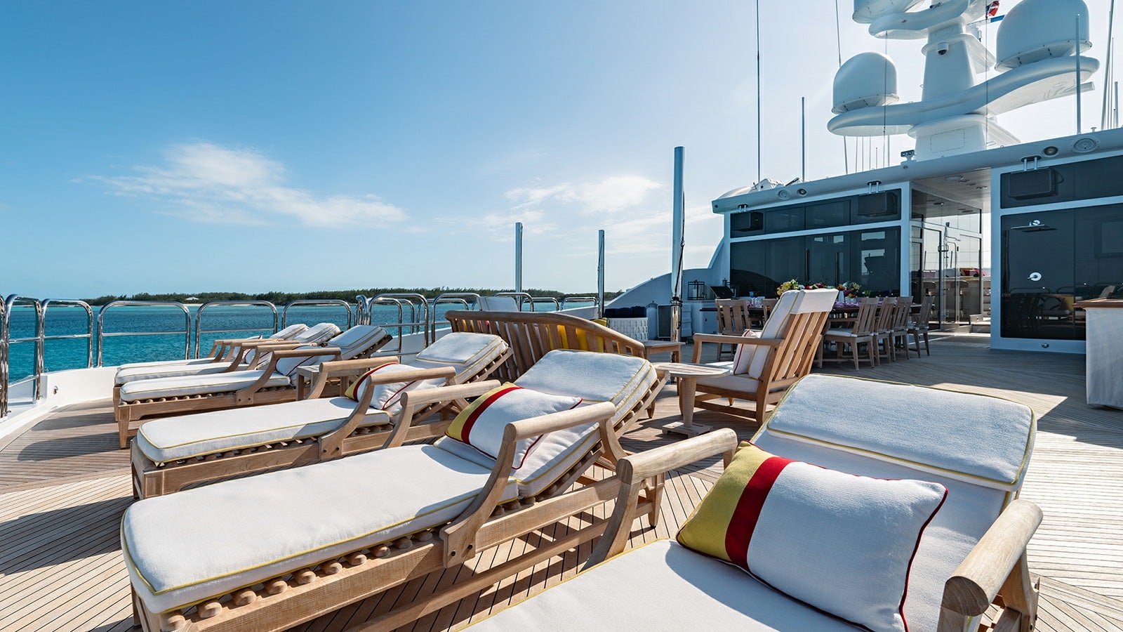 a deck with chairs and tables aboard IRON BLONDE Yacht for Charter