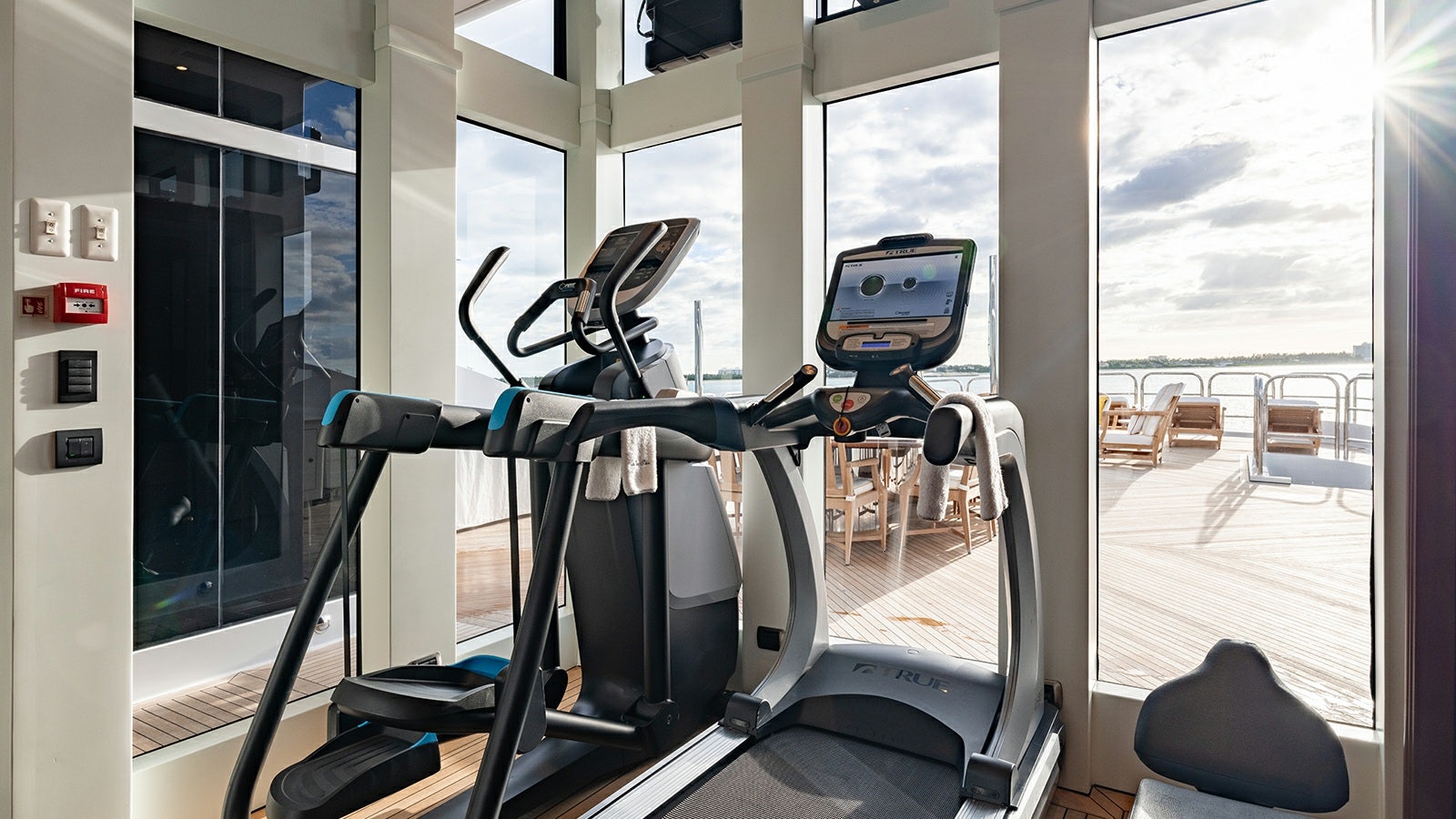 a treadmill in a room aboard IRON BLONDE Yacht for Charter