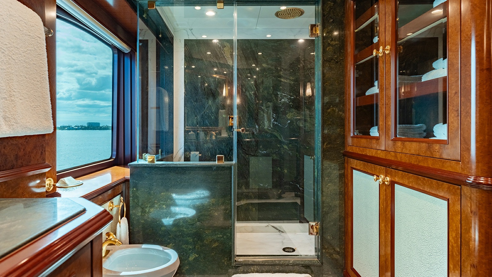 a bathroom with a glass shower aboard IRON BLONDE Yacht for Charter