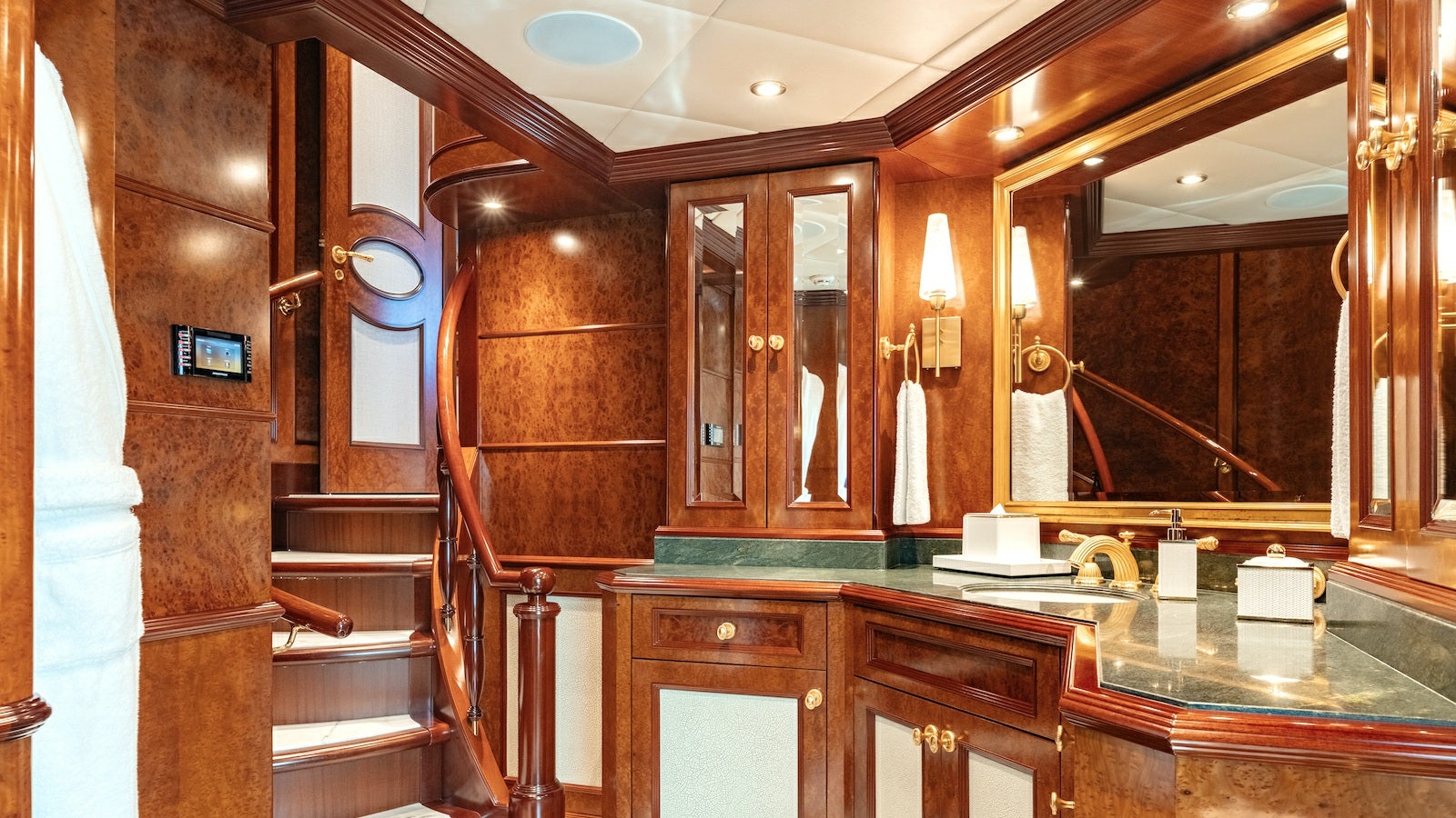 a bathroom with a large mirror aboard IRON BLONDE Yacht for Charter