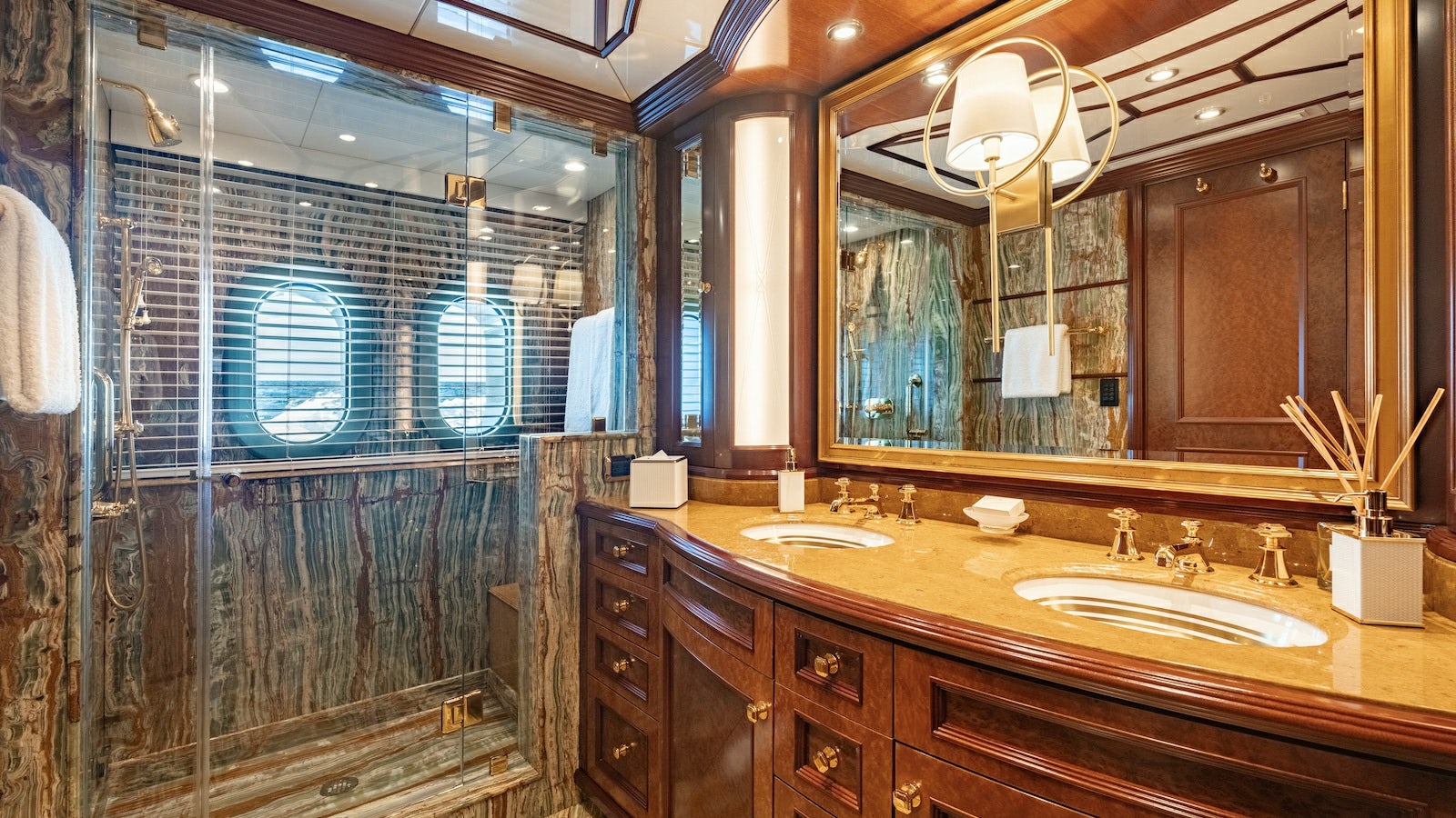 a bathroom with a large mirror aboard IRON BLONDE Yacht for Charter