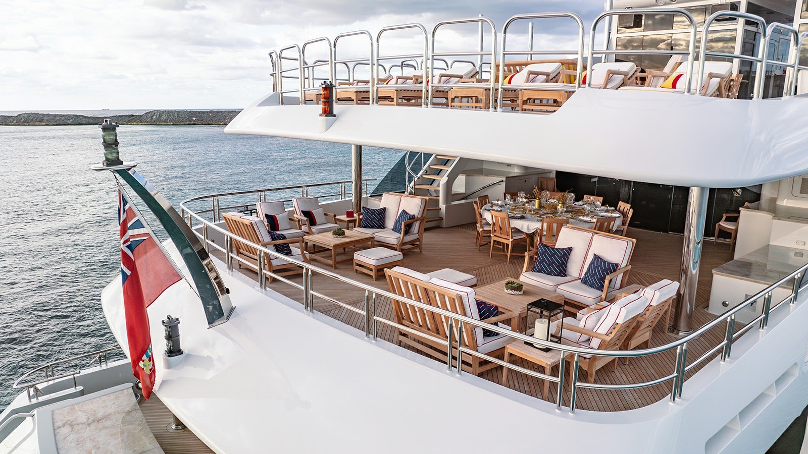 a deck with chairs and tables on it aboard IRON BLONDE Yacht for Charter