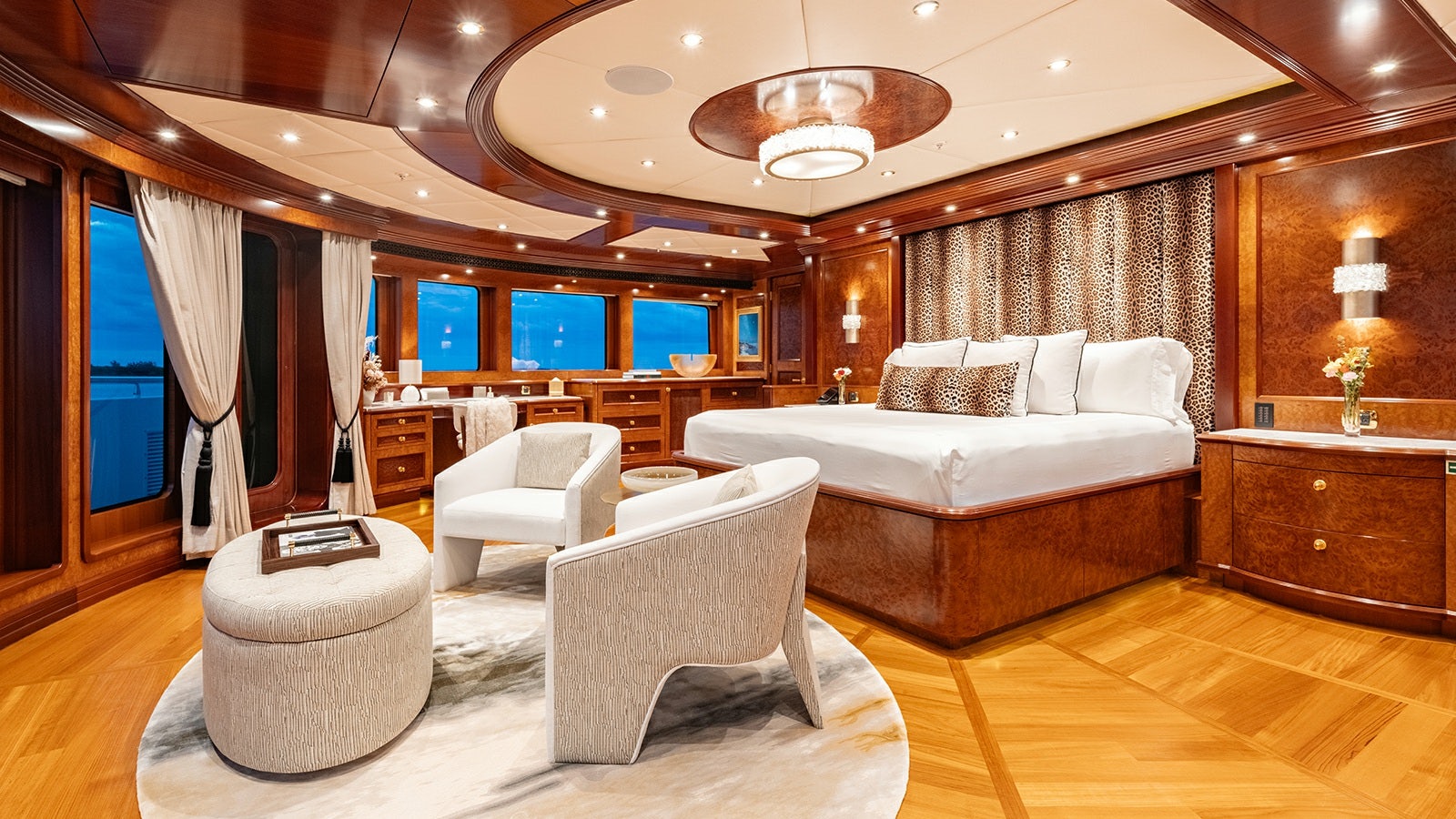 a large room with a bed and a couch aboard IRON BLONDE Yacht for Charter