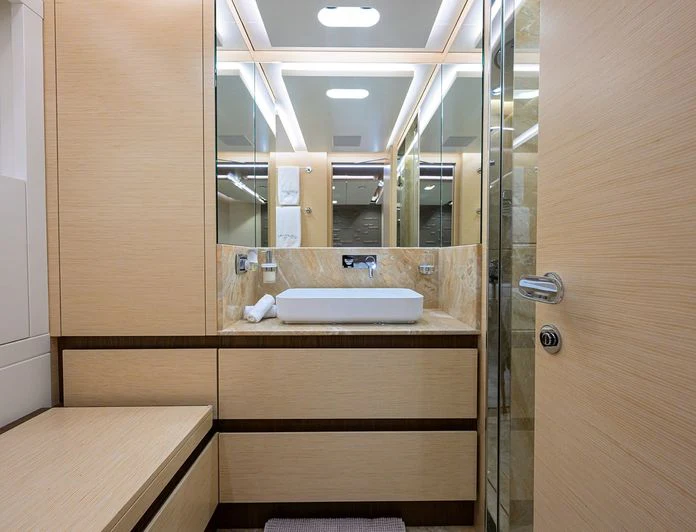 a bathroom with a sink and a mirror aboard TROPA Yacht for Charter