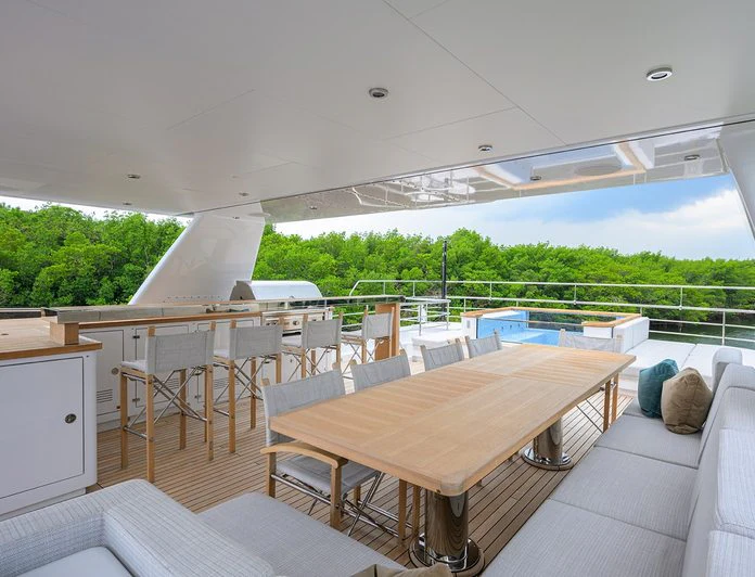 a room with a table and chairs aboard TROPA Yacht for Charter