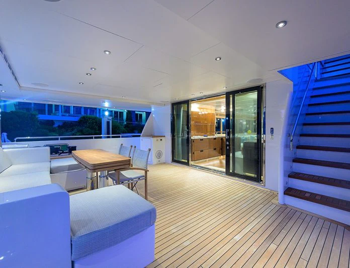 a room with a table and chairs aboard TROPA Yacht for Charter