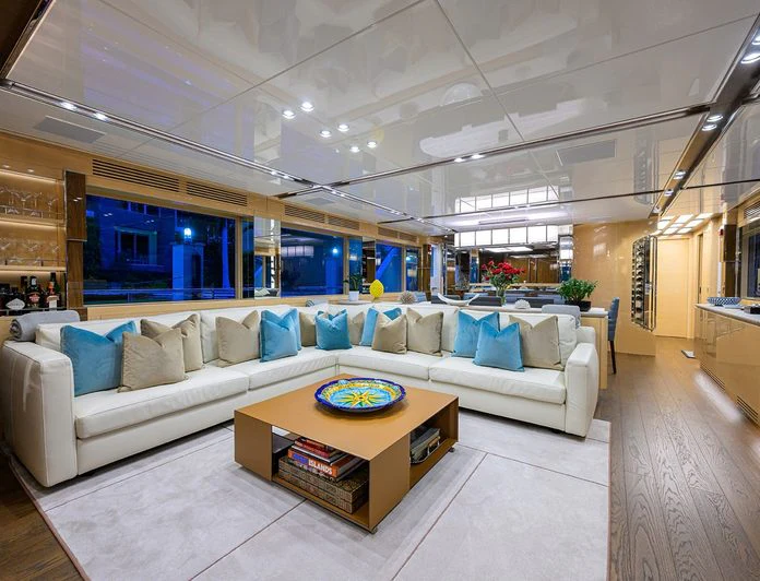 a living room with a couch and a table aboard TROPA Yacht for Charter