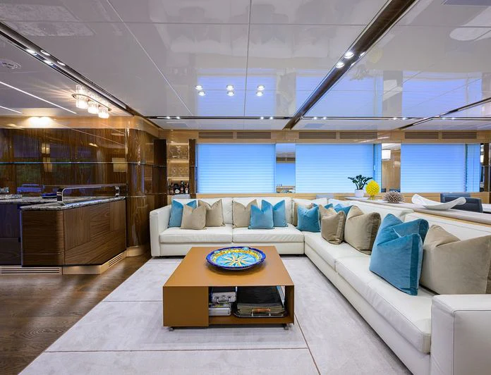 a living room with a couch and a table aboard TROPA Yacht for Charter