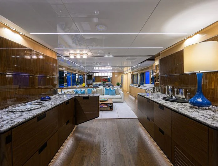 a kitchen with a large island aboard TROPA Yacht for Charter