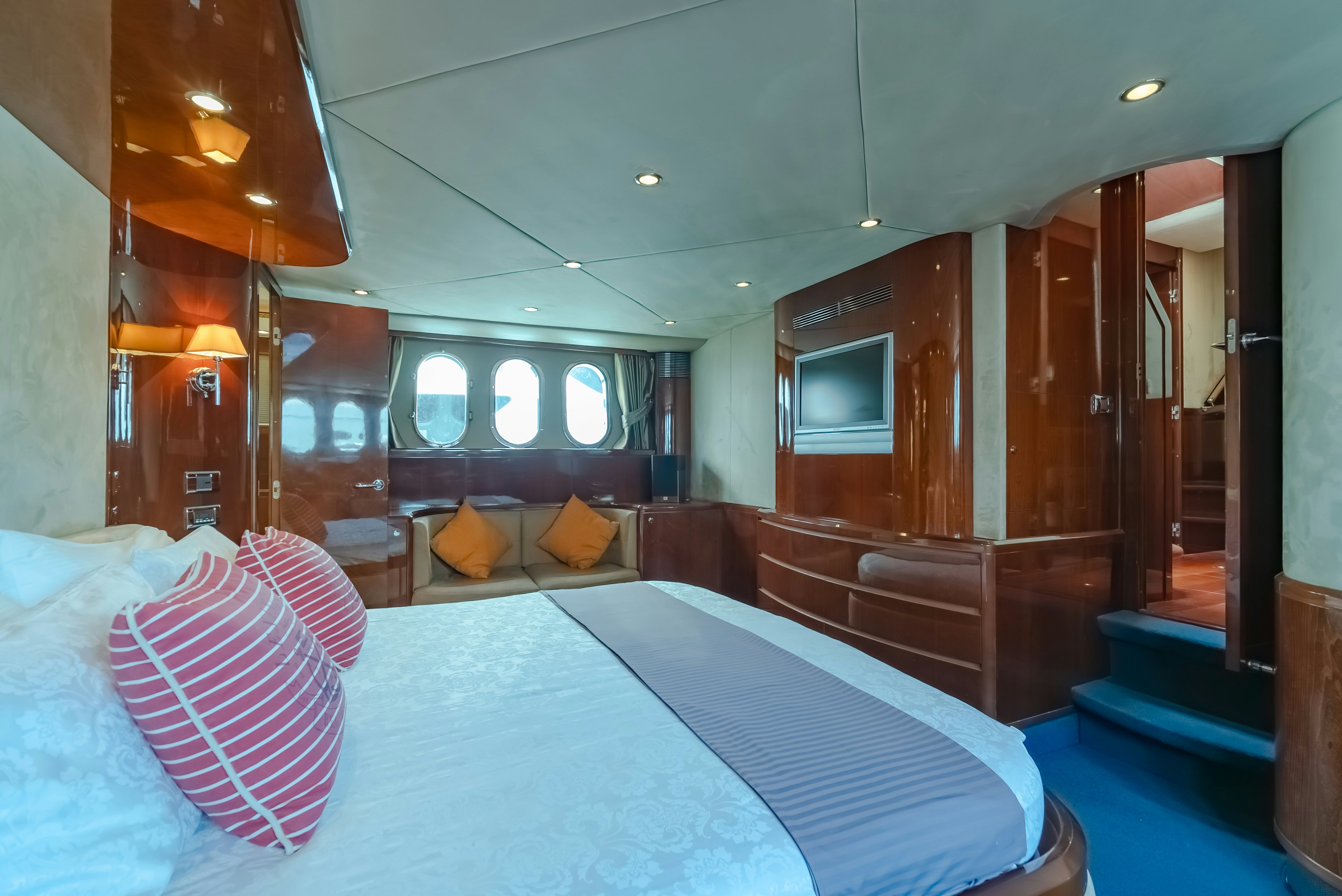 a room with a bed and a window aboard BLUE ROSE Yacht for Sale