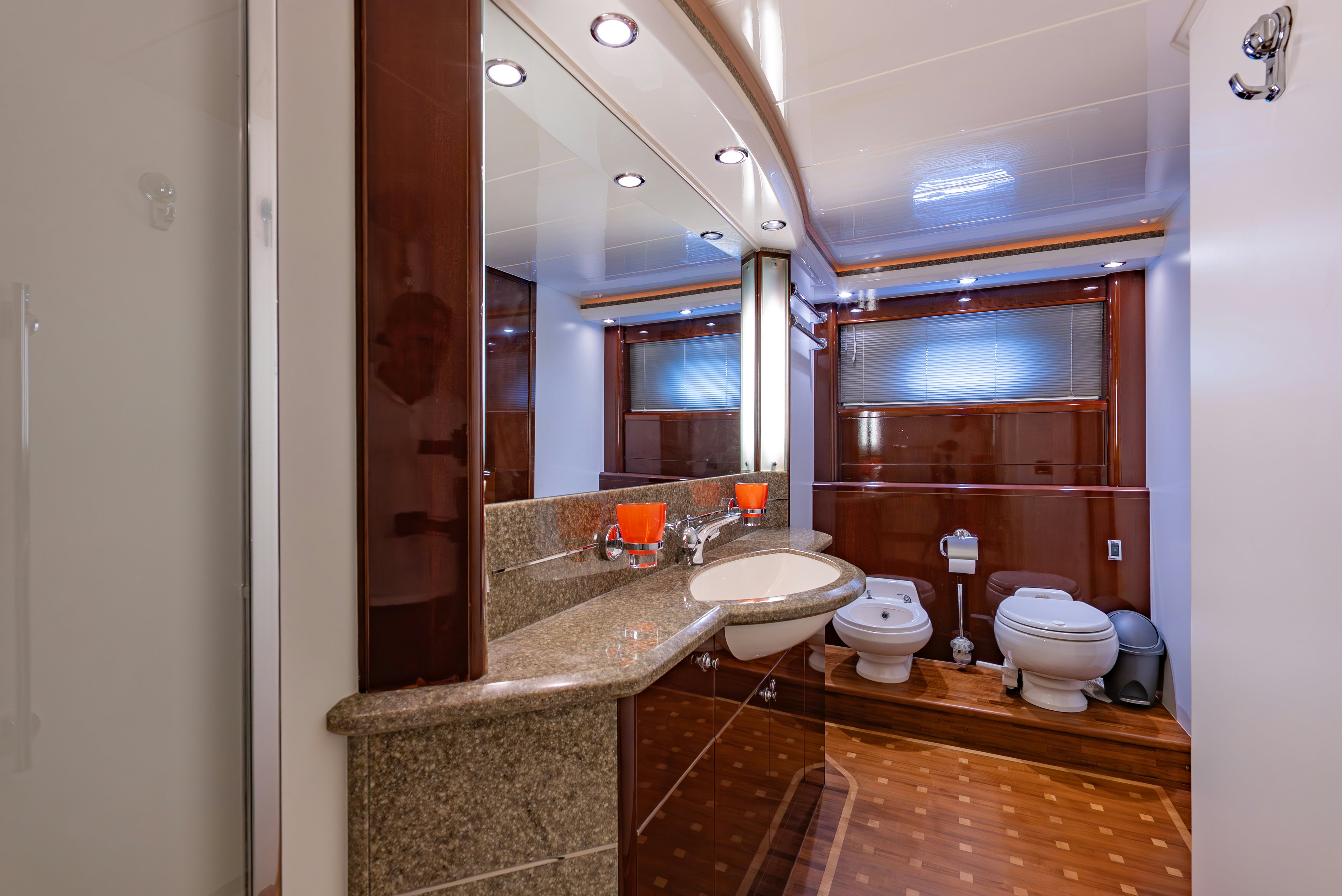 a bathroom with a large mirror aboard BLUE ROSE Yacht for Sale