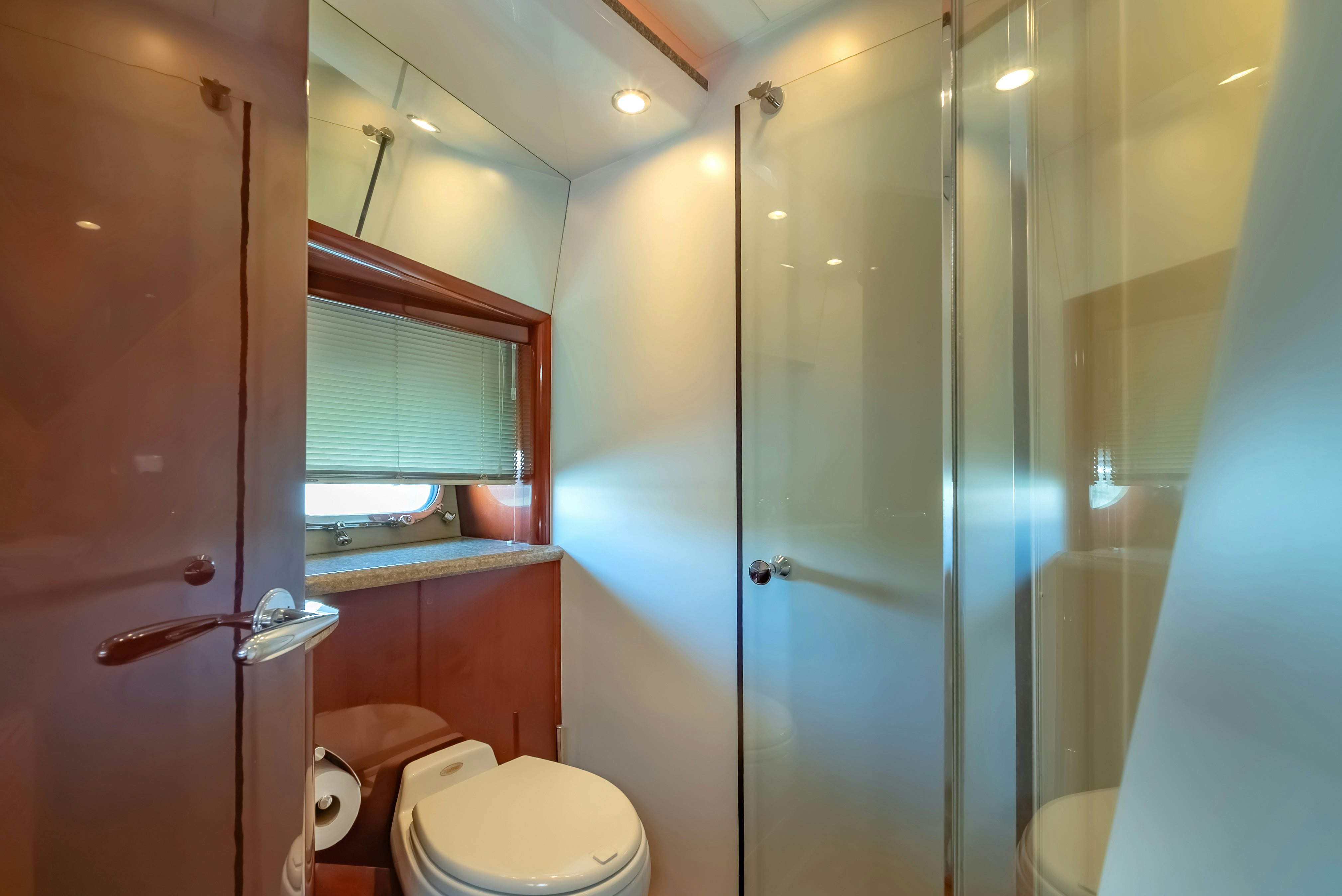 a bathroom with a glass shower door aboard BLUE ROSE Yacht for Sale