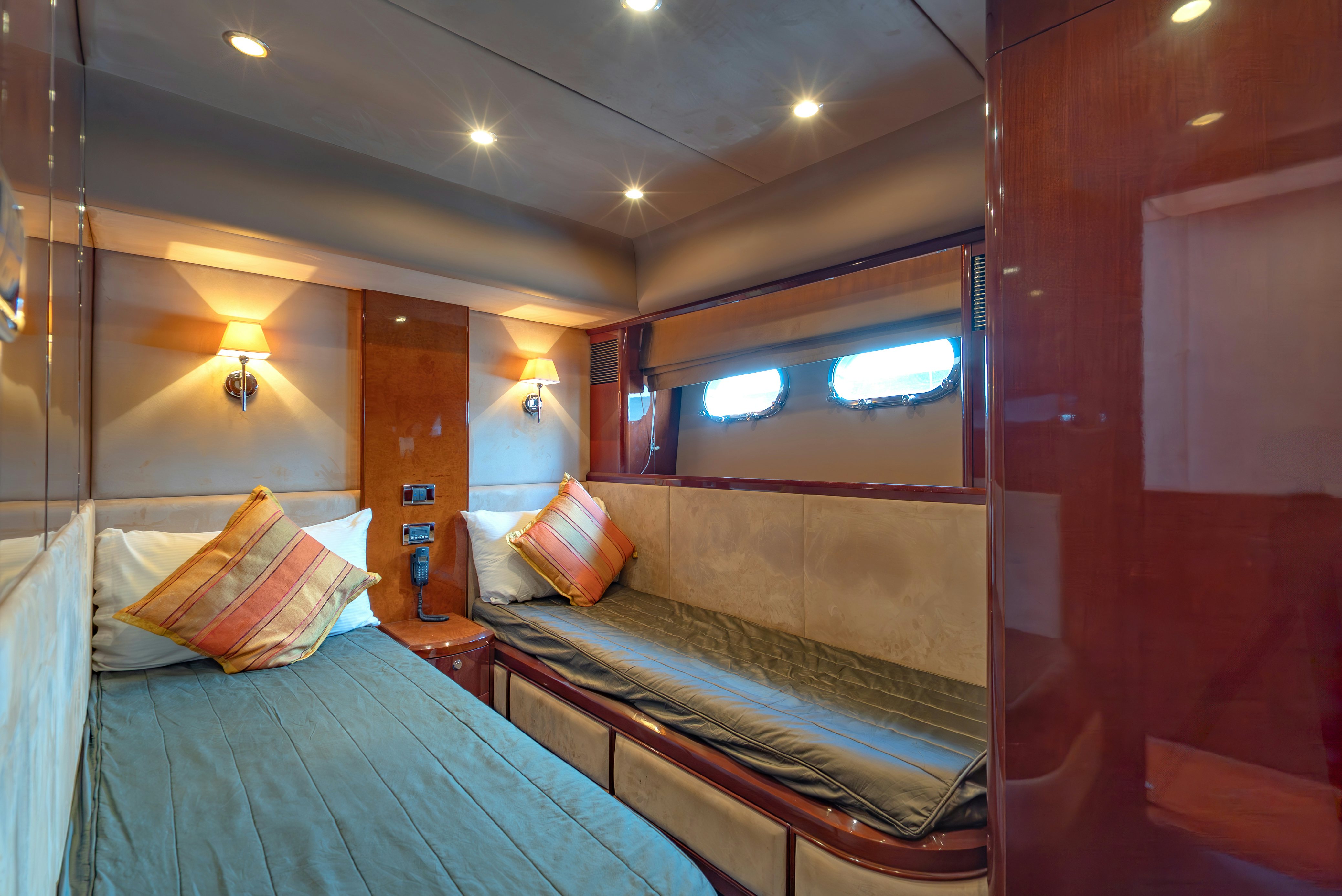 a room with a bed and a window aboard BLUE ROSE Yacht for Sale