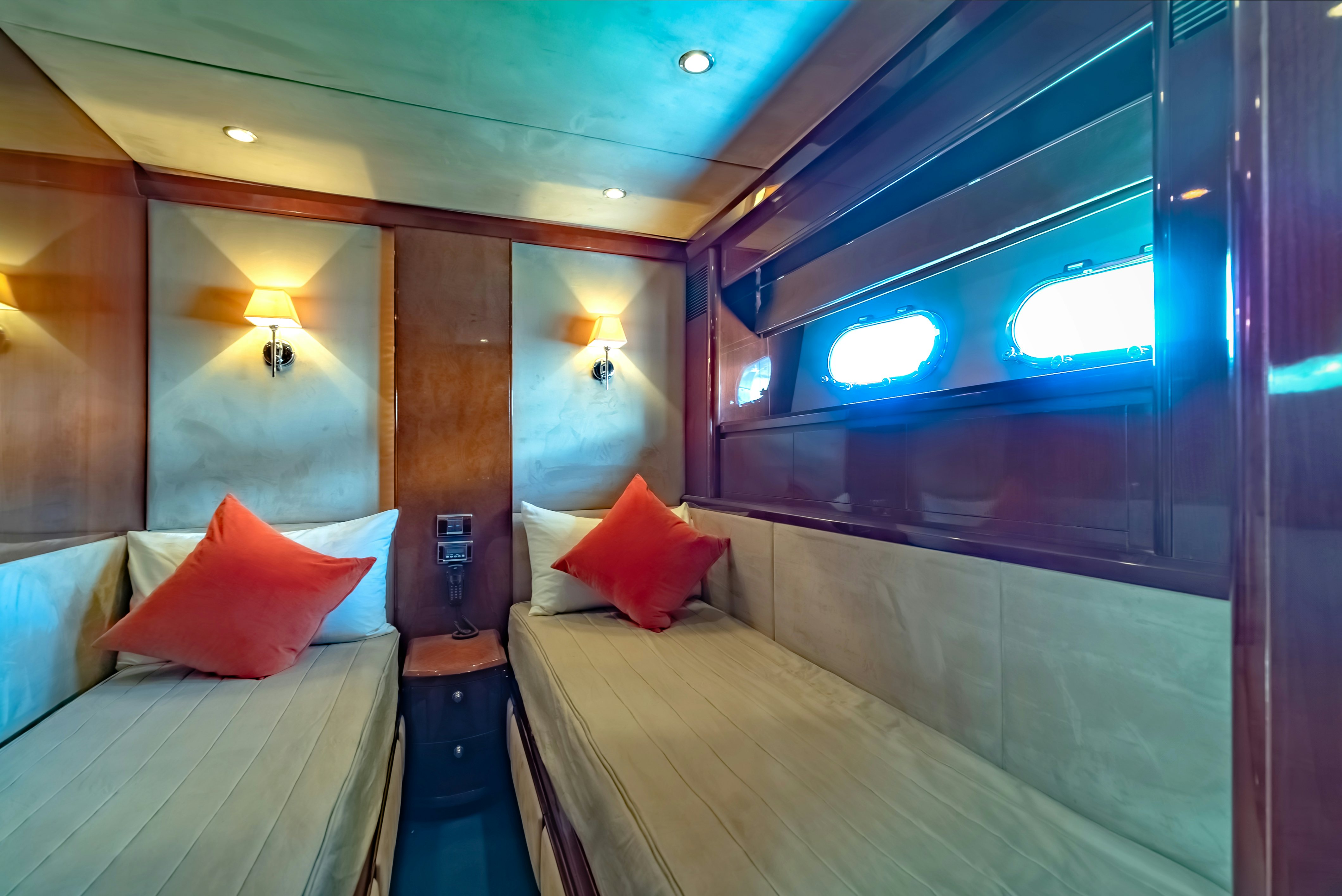 a room with a bed and a mirror aboard BLUE ROSE Yacht for Sale