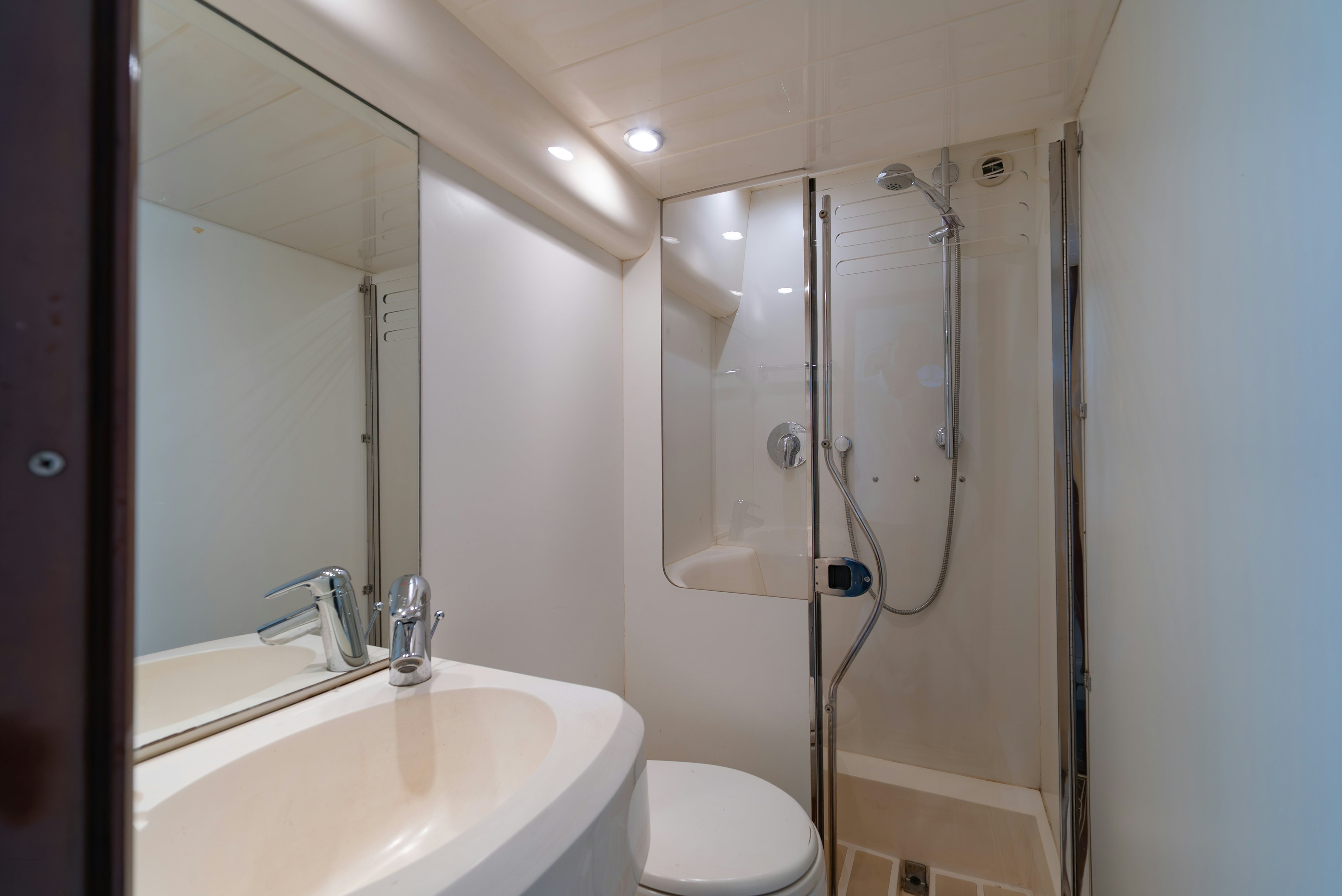 a bathroom with a shower and sink aboard BLUE ROSE Yacht for Sale