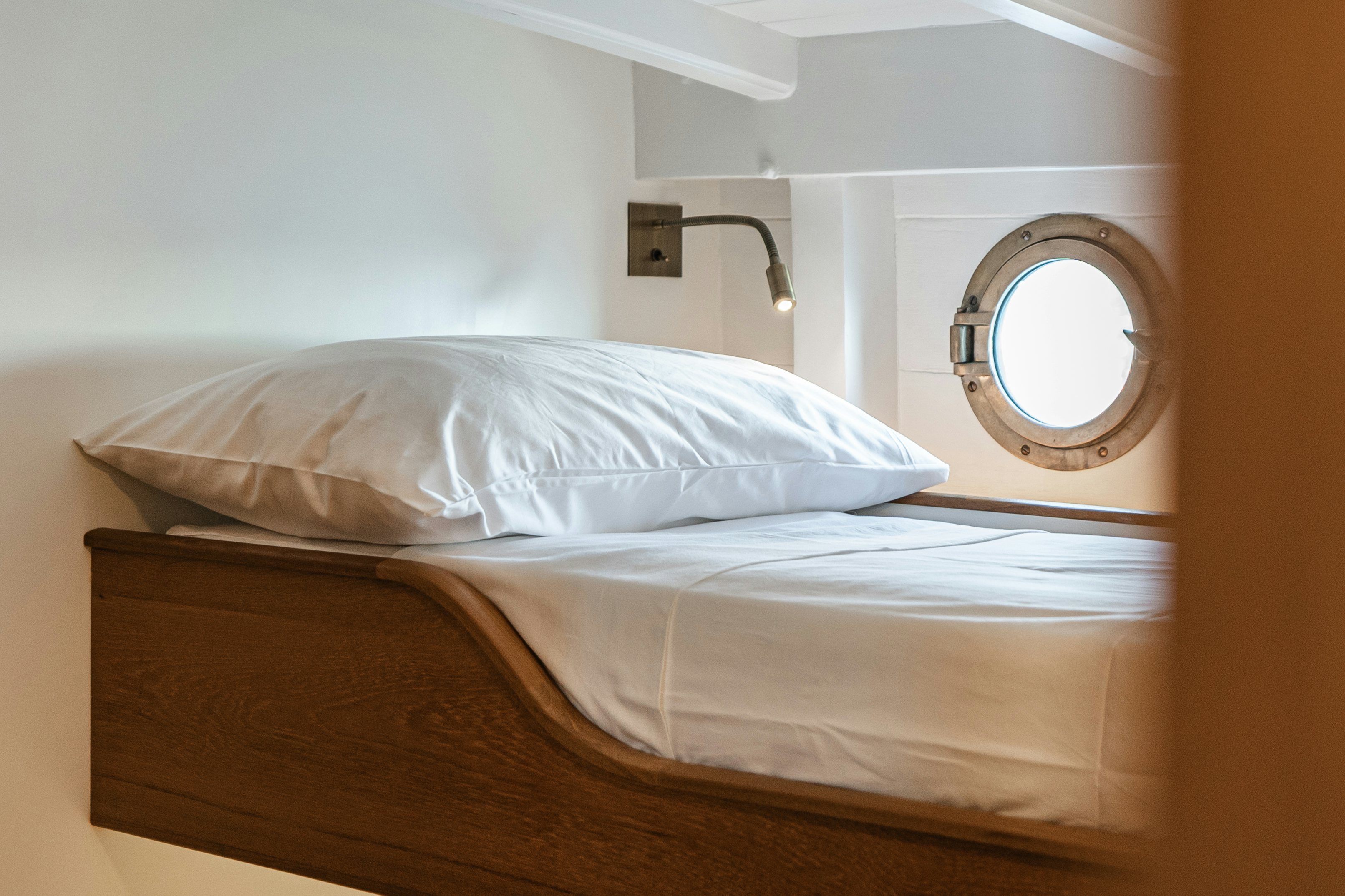 a bed with a mirror above it aboard SILVER LASS Yacht for Sale