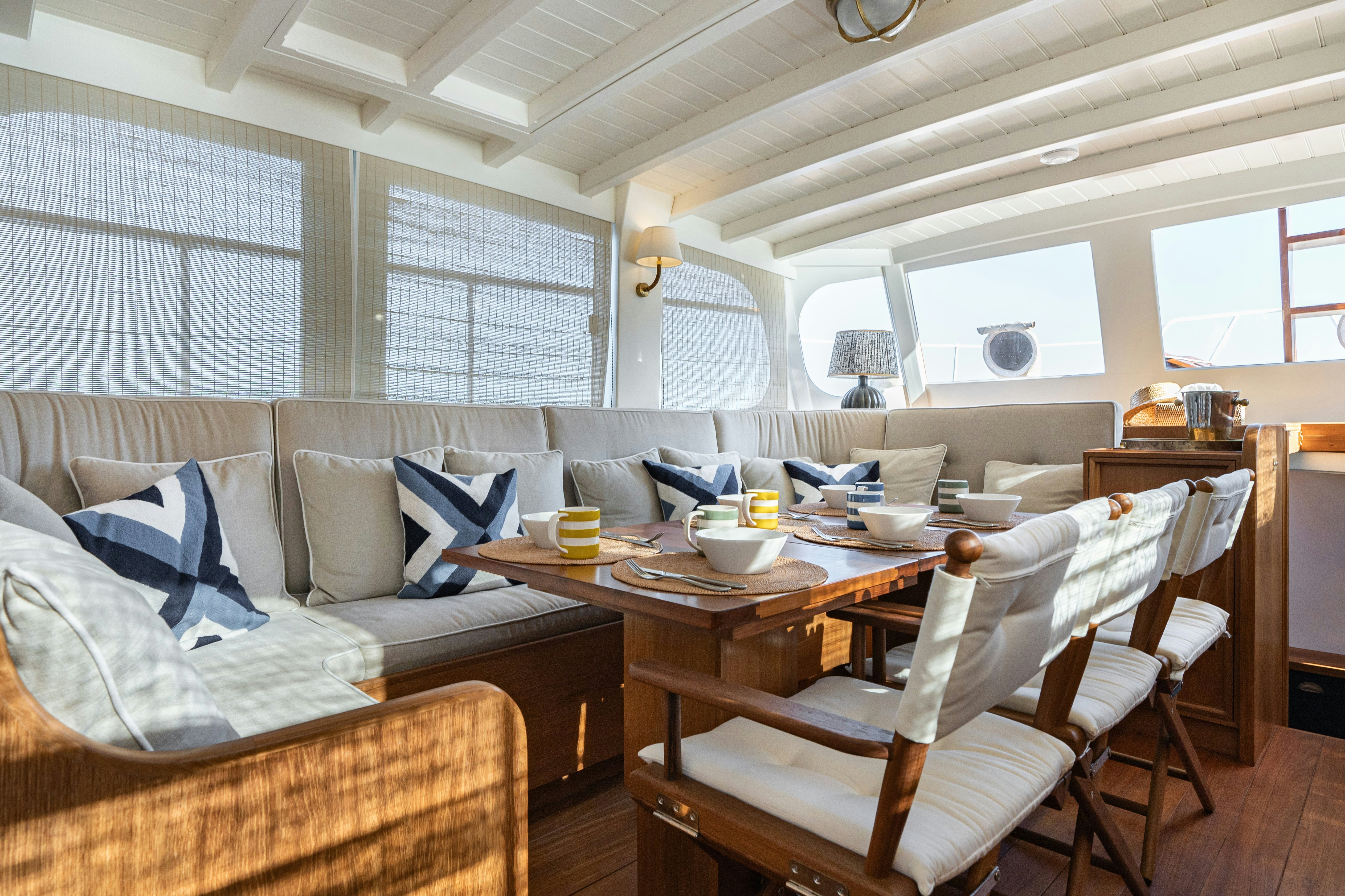 a living room with a couch and a table aboard SILVER LASS Yacht for Sale