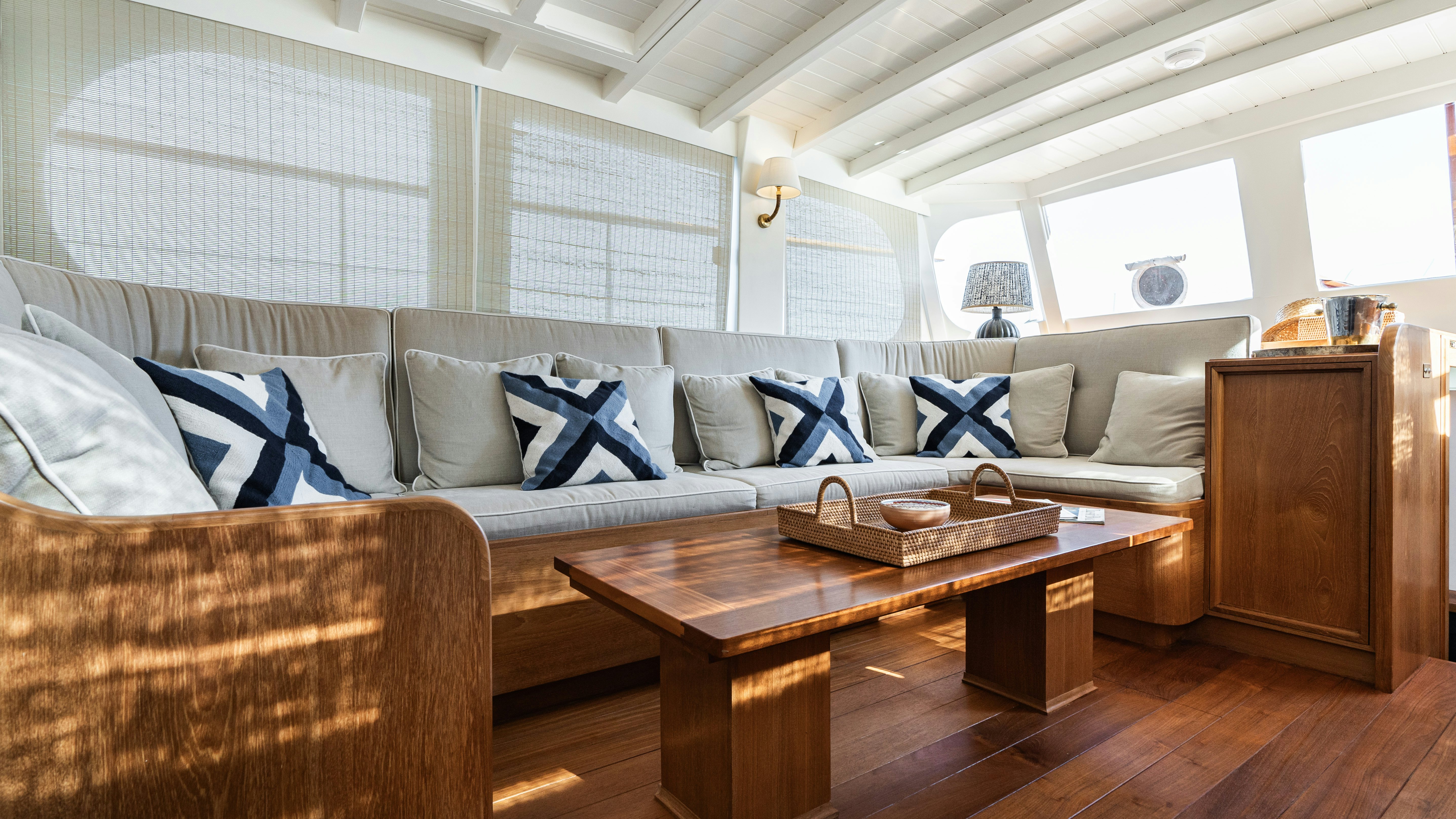 a living room with a couch and a table aboard SILVER LASS Yacht for Sale