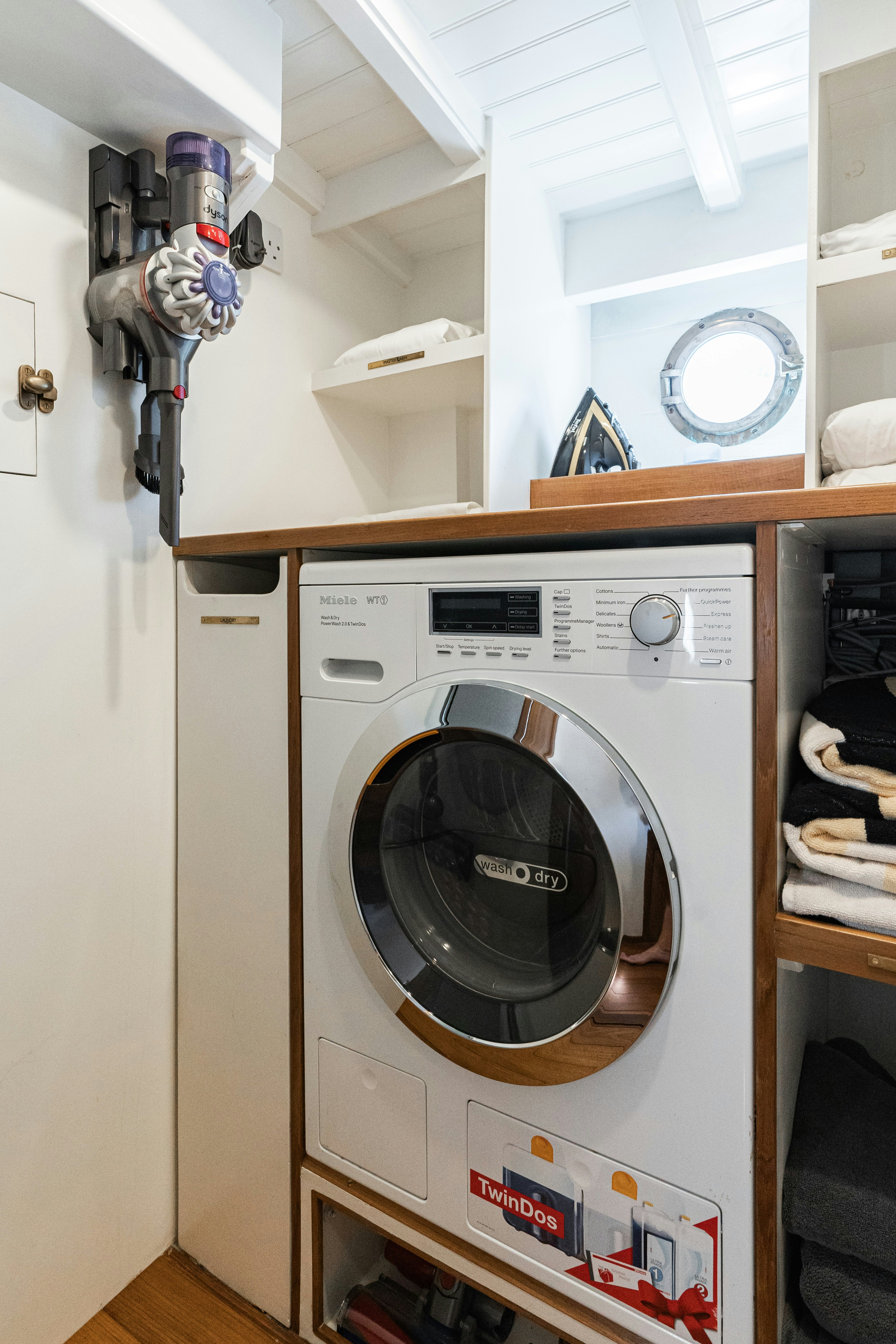 a white machine with a round black object on the side aboard SILVER LASS Yacht for Sale