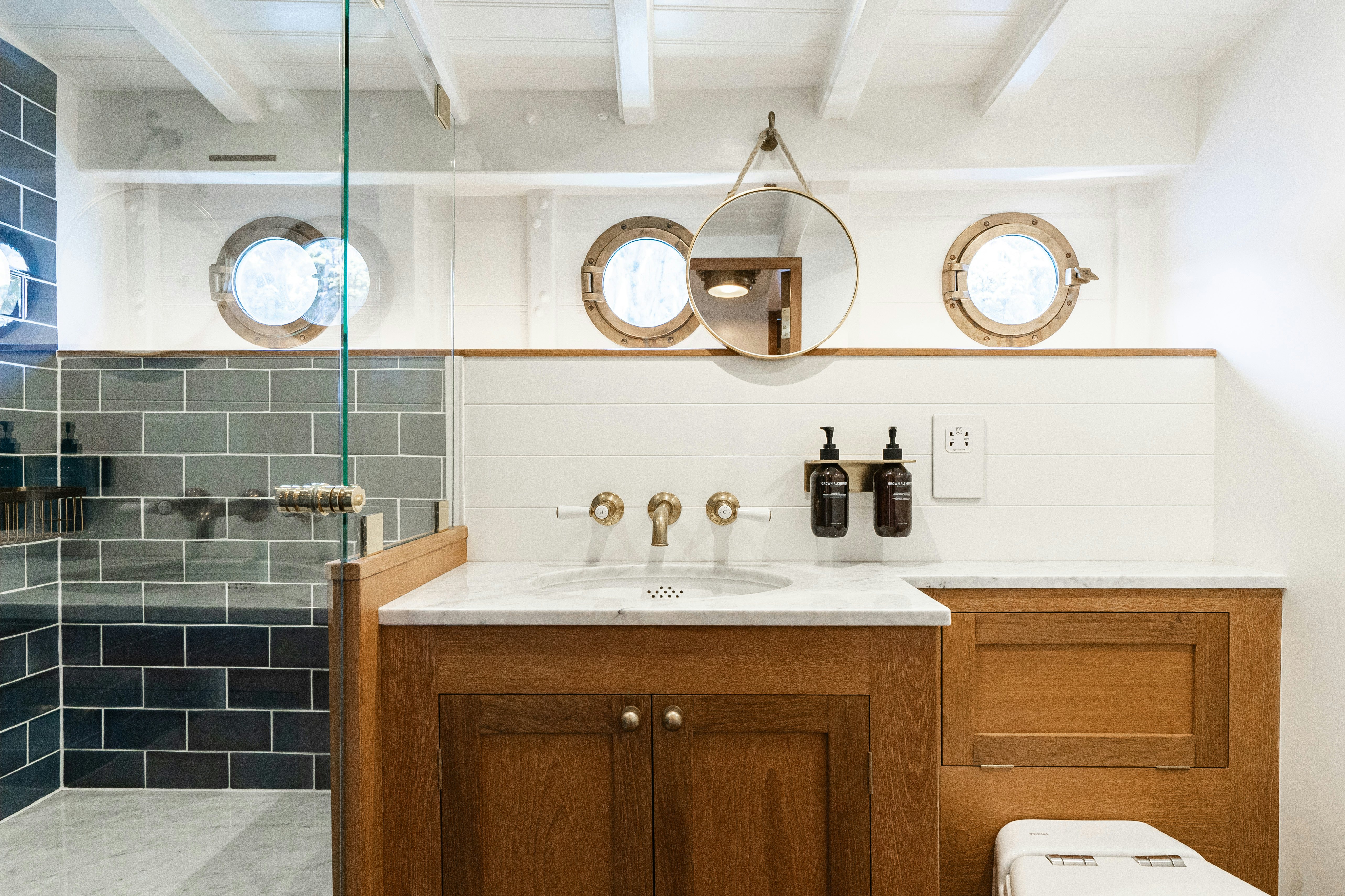 a bathroom with a sink and a mirror aboard SILVER LASS Yacht for Sale
