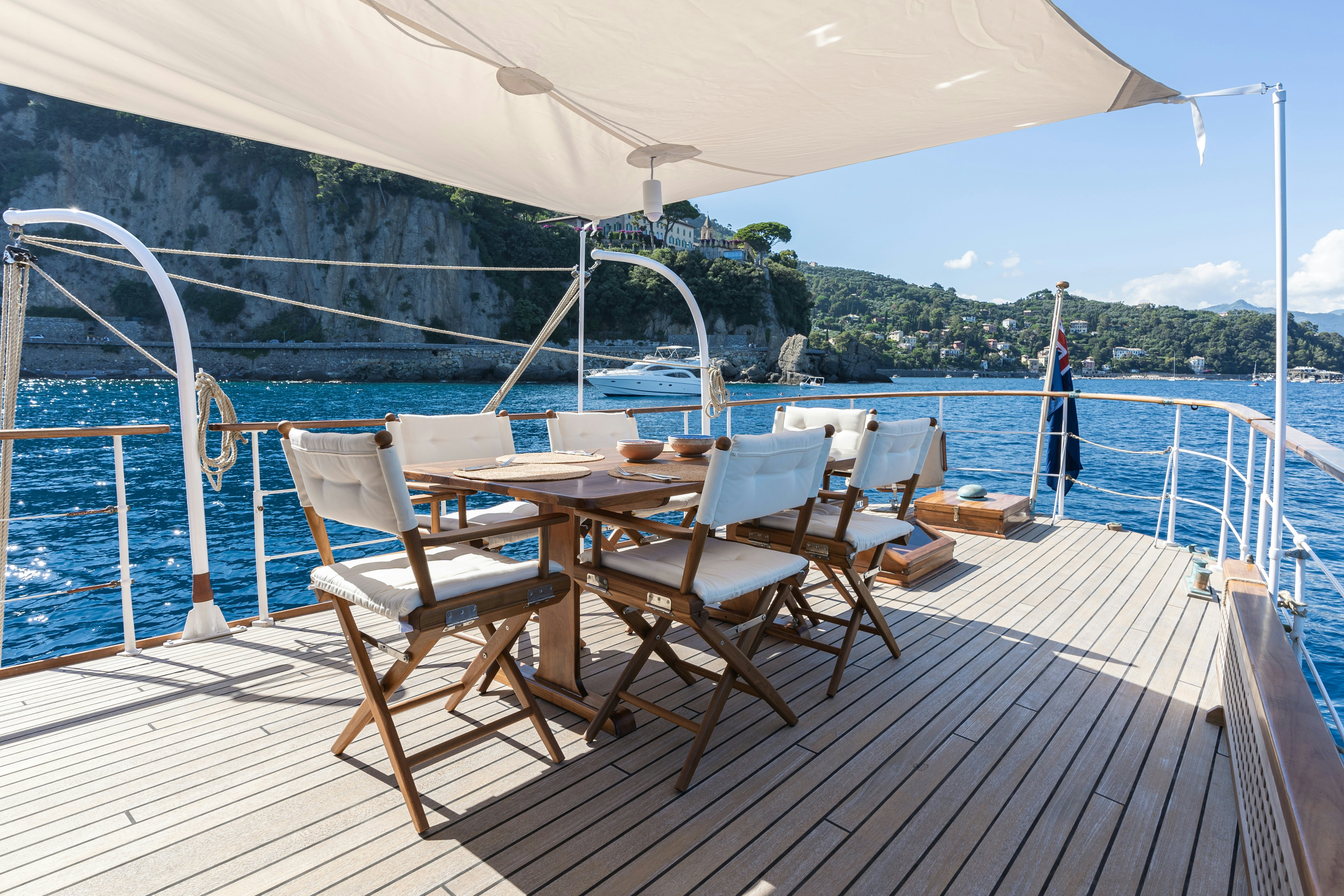 a deck with chairs and tables on it aboard SILVER LASS Yacht for Sale