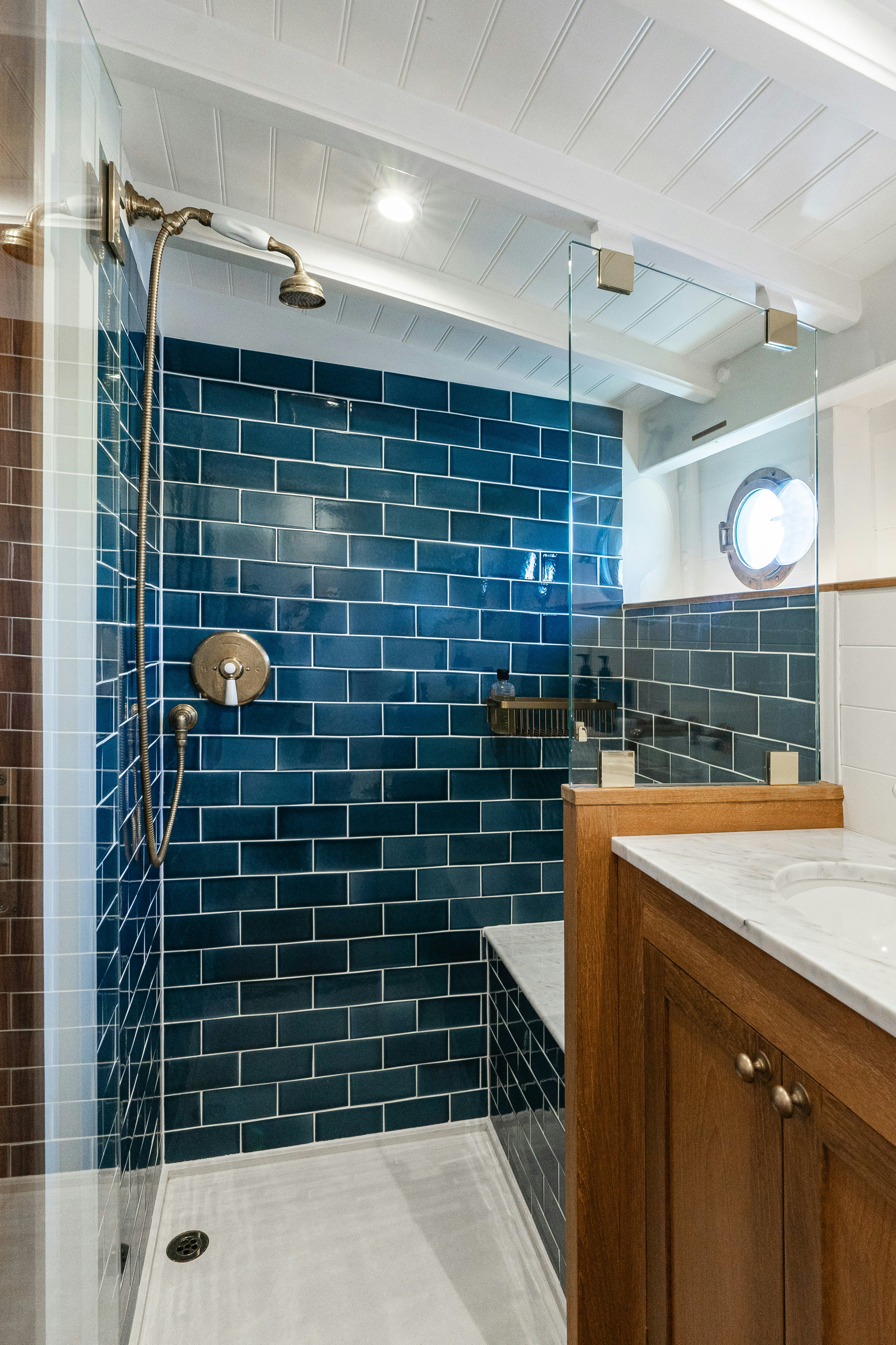 a shower with a tile wall aboard SILVER LASS Yacht for Sale