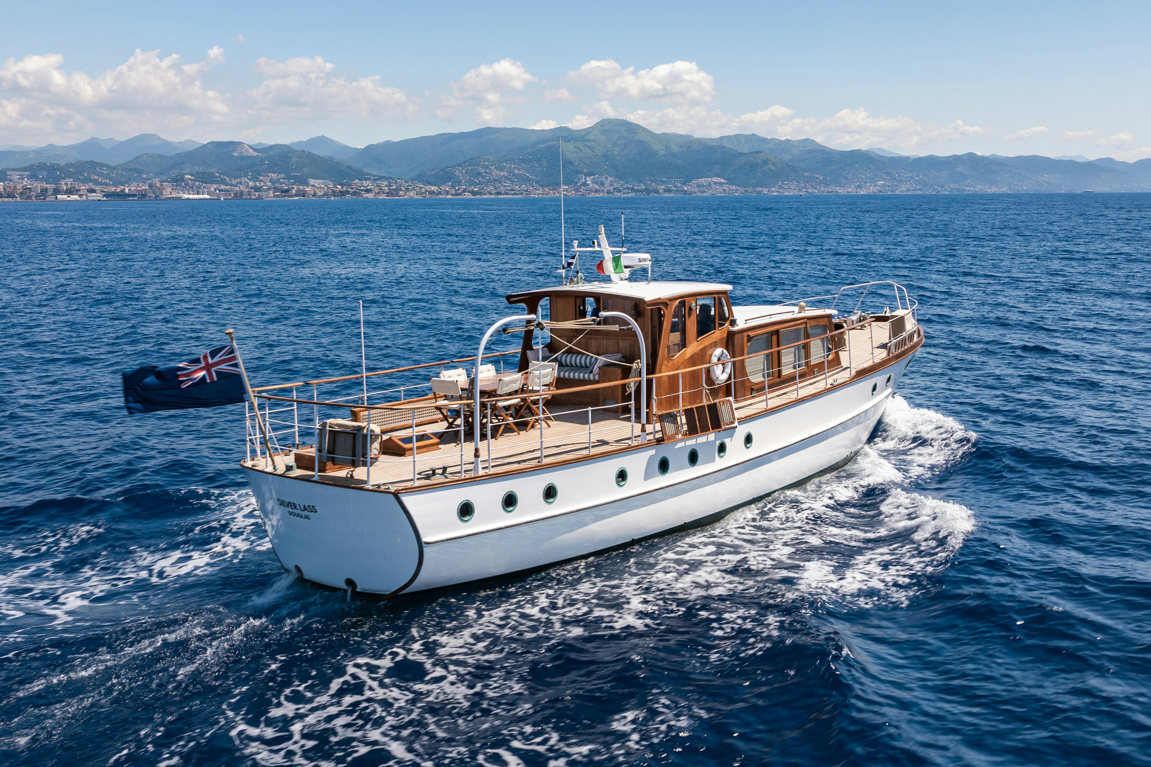 a boat with a red and black boat on water aboard SILVER LASS Yacht for Sale