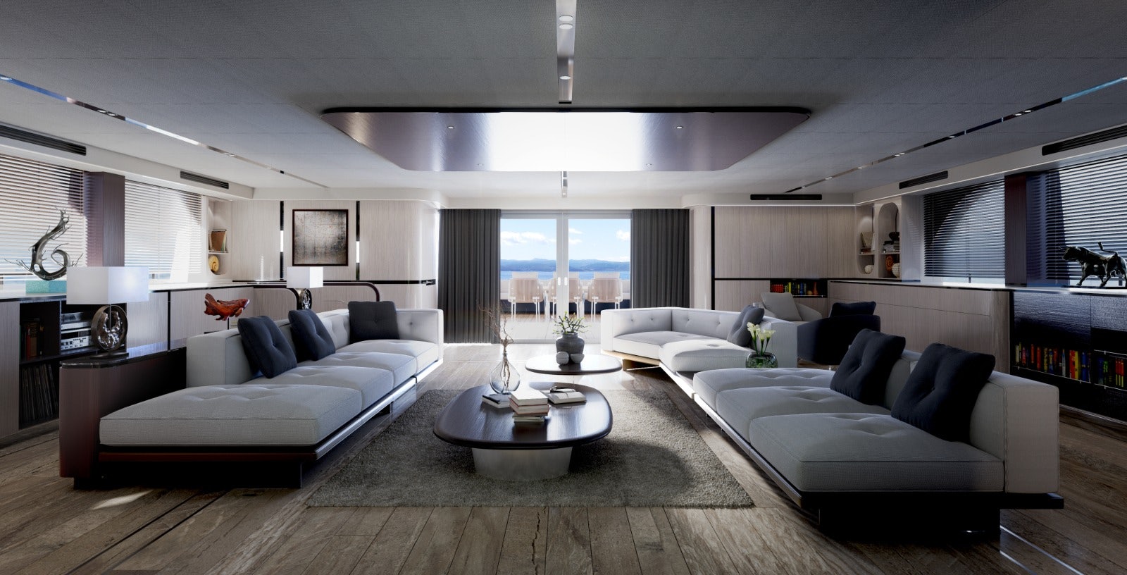 a living room with a large white couch and a large window aboard VISION F – 101 ALU Yacht for Sale
