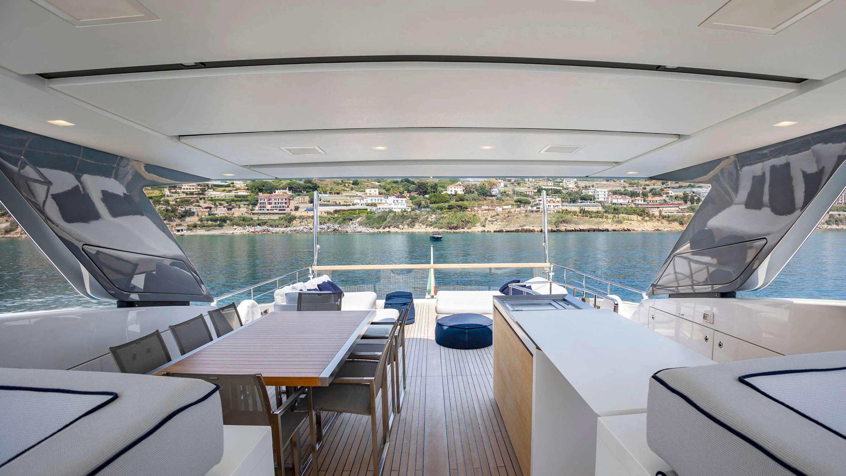 a deck with a view of a city and a body of water aboard FRANCAMARINA Yacht for Charter