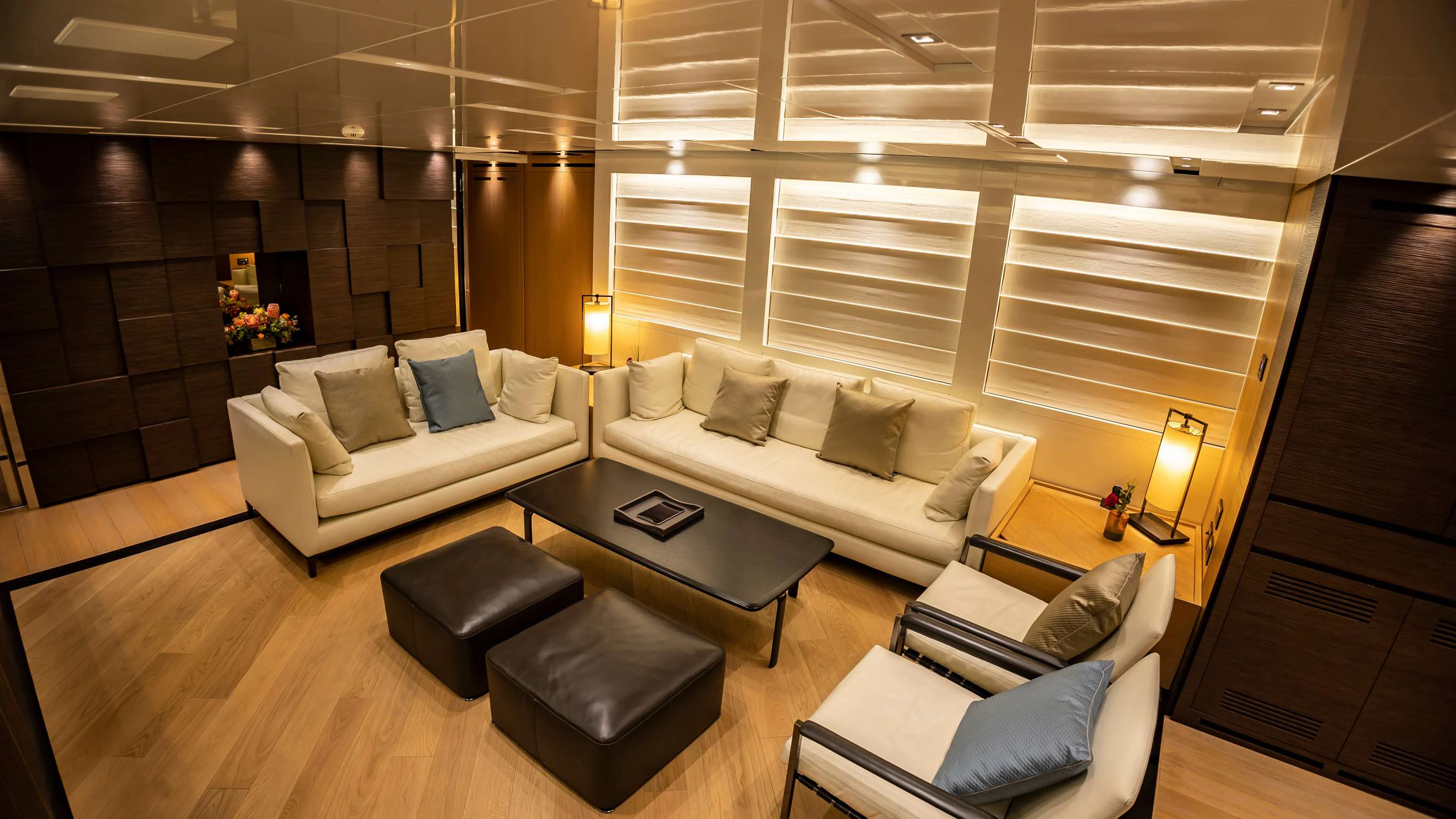 a living room with a couch and a table aboard FRANCAMARINA Yacht for Charter