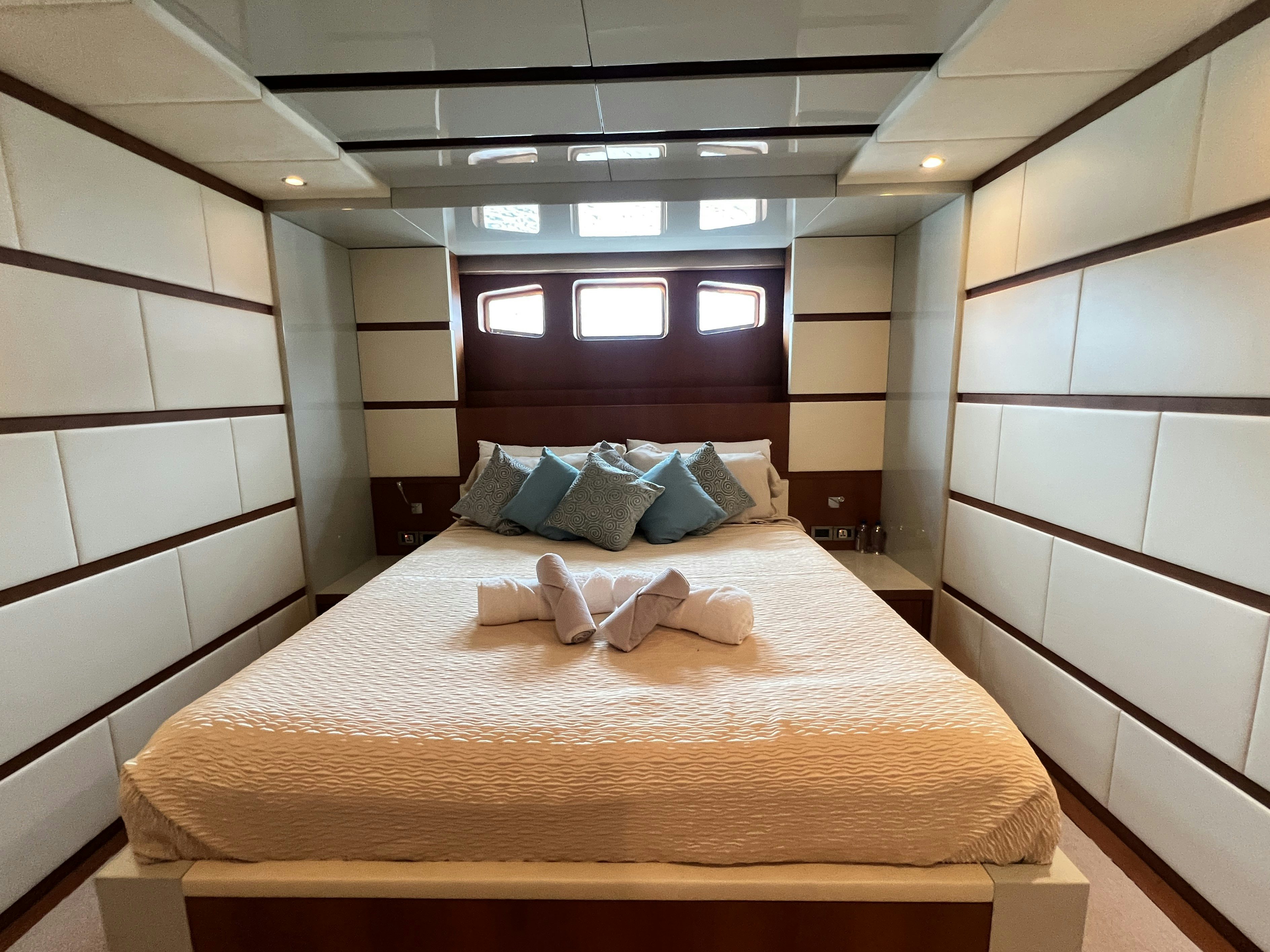 a bed with a large bed aboard SUNRISE Yacht for Sale
