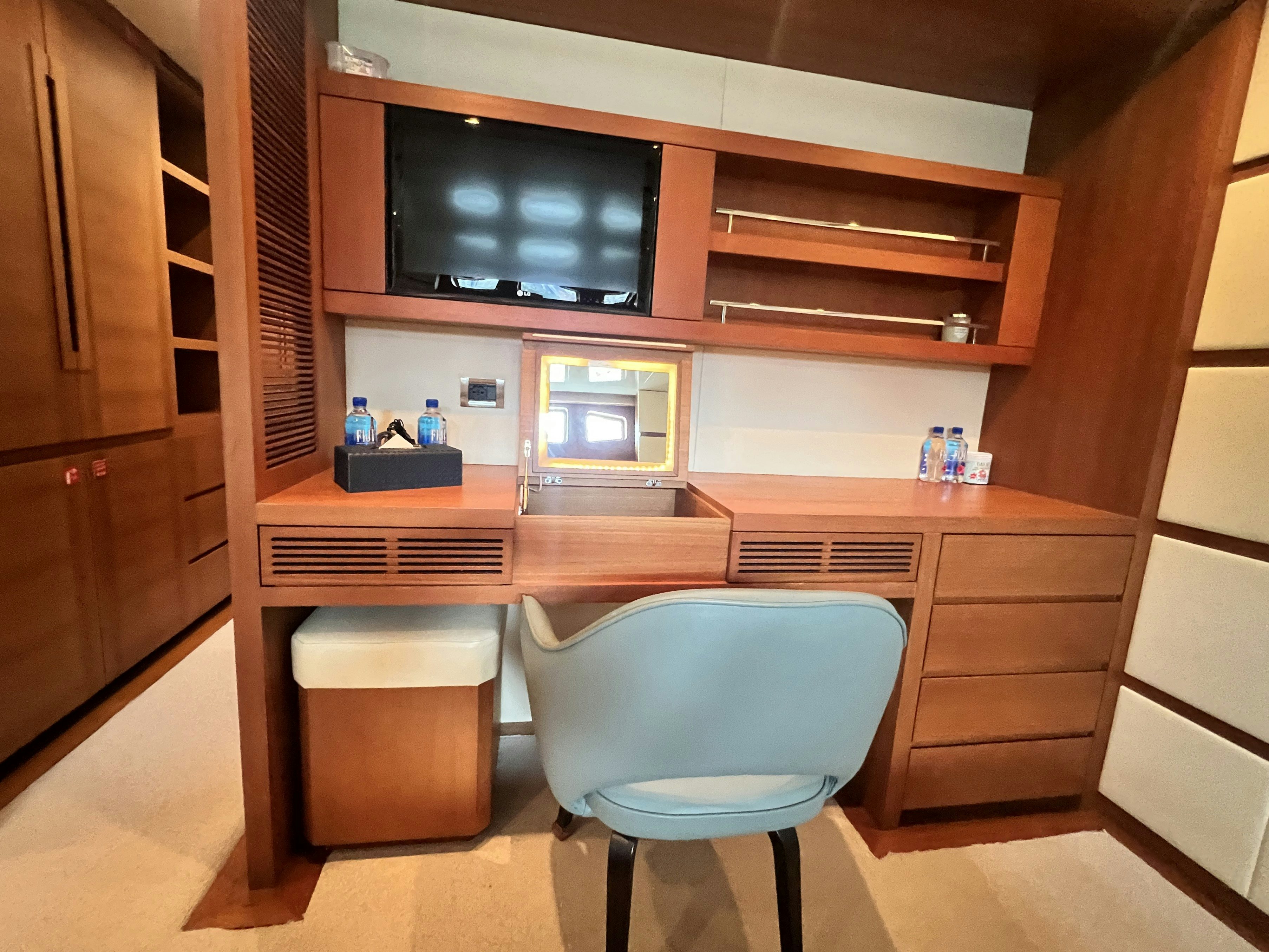 a room with a tv and a chair aboard SUNRISE Yacht for Sale