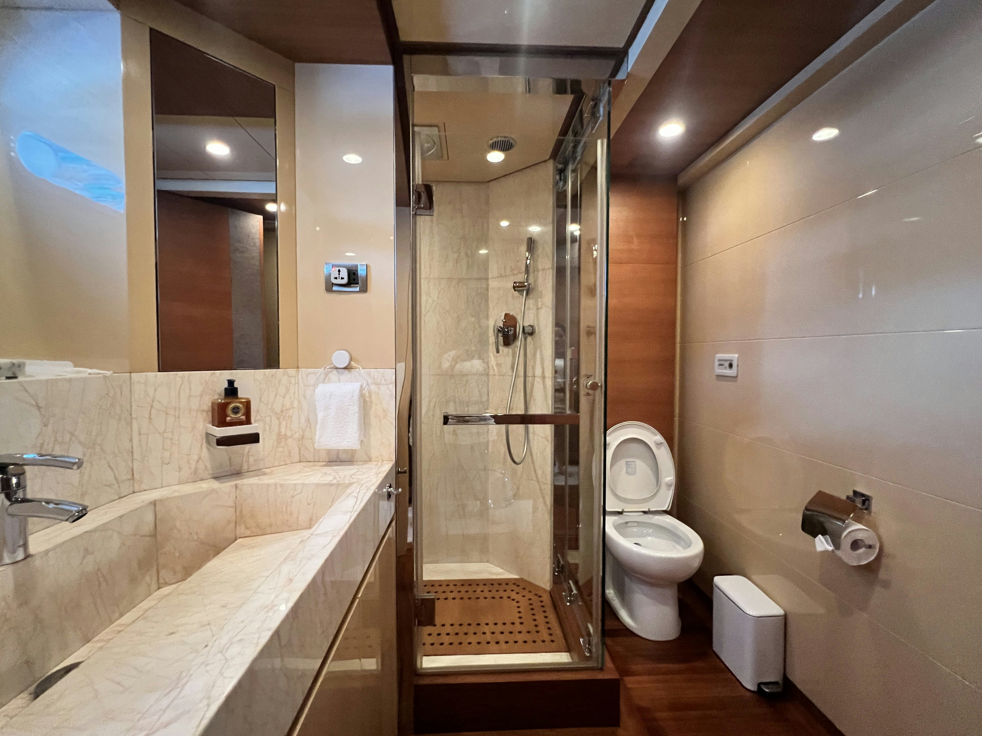 a bathroom with a shower and toilet aboard SUNRISE Yacht for Sale