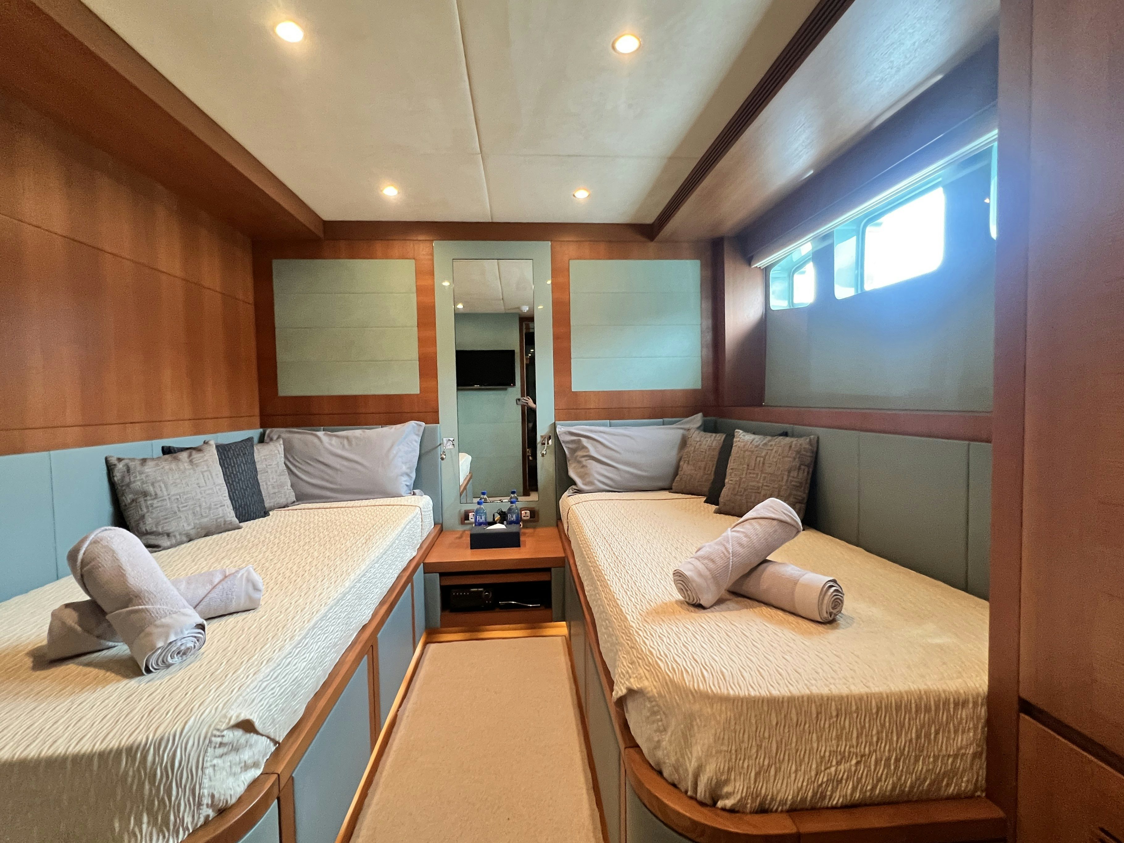 a room with two beds aboard SUNRISE Yacht for Sale