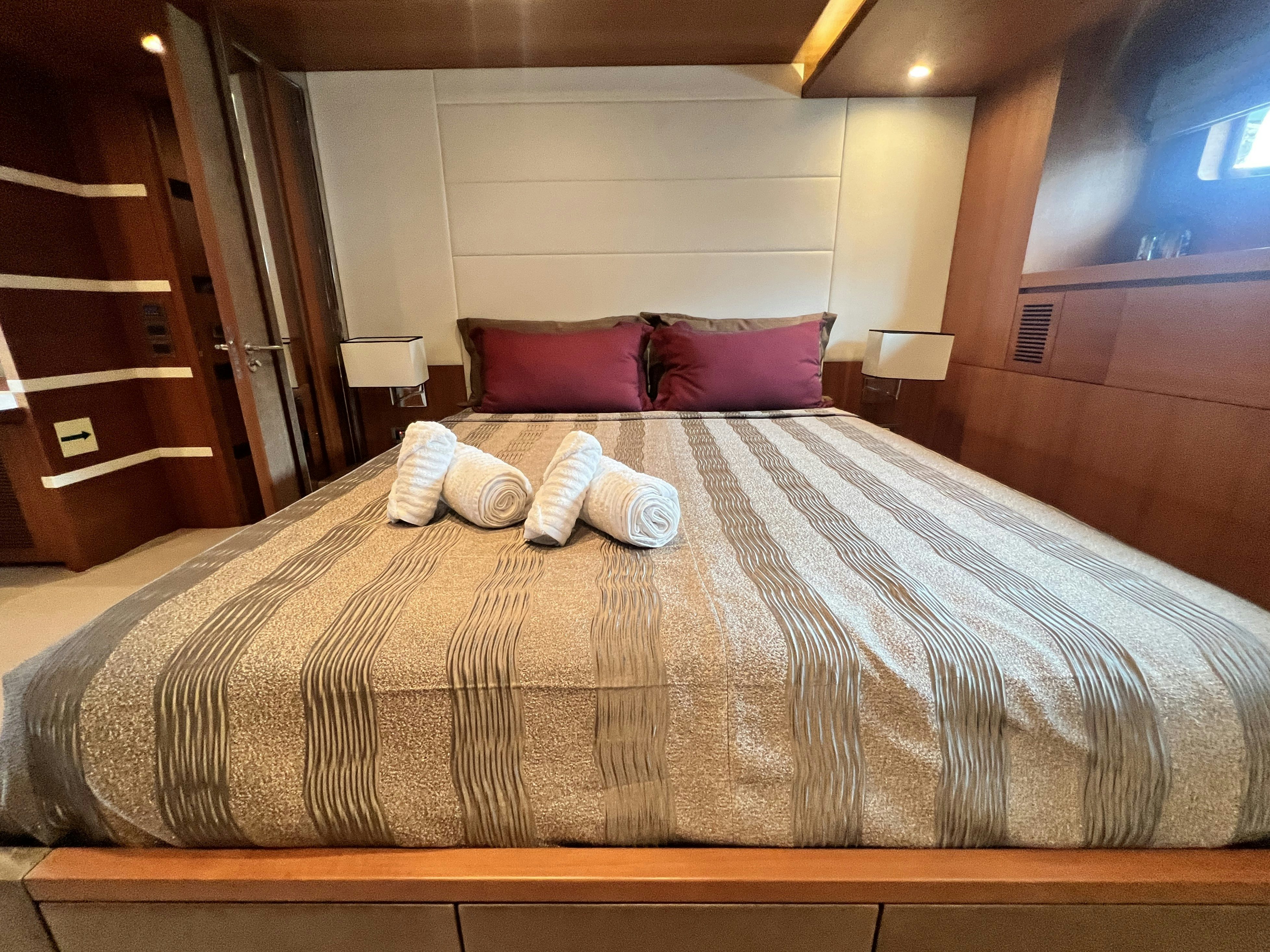a bed with pillows aboard SUNRISE Yacht for Sale