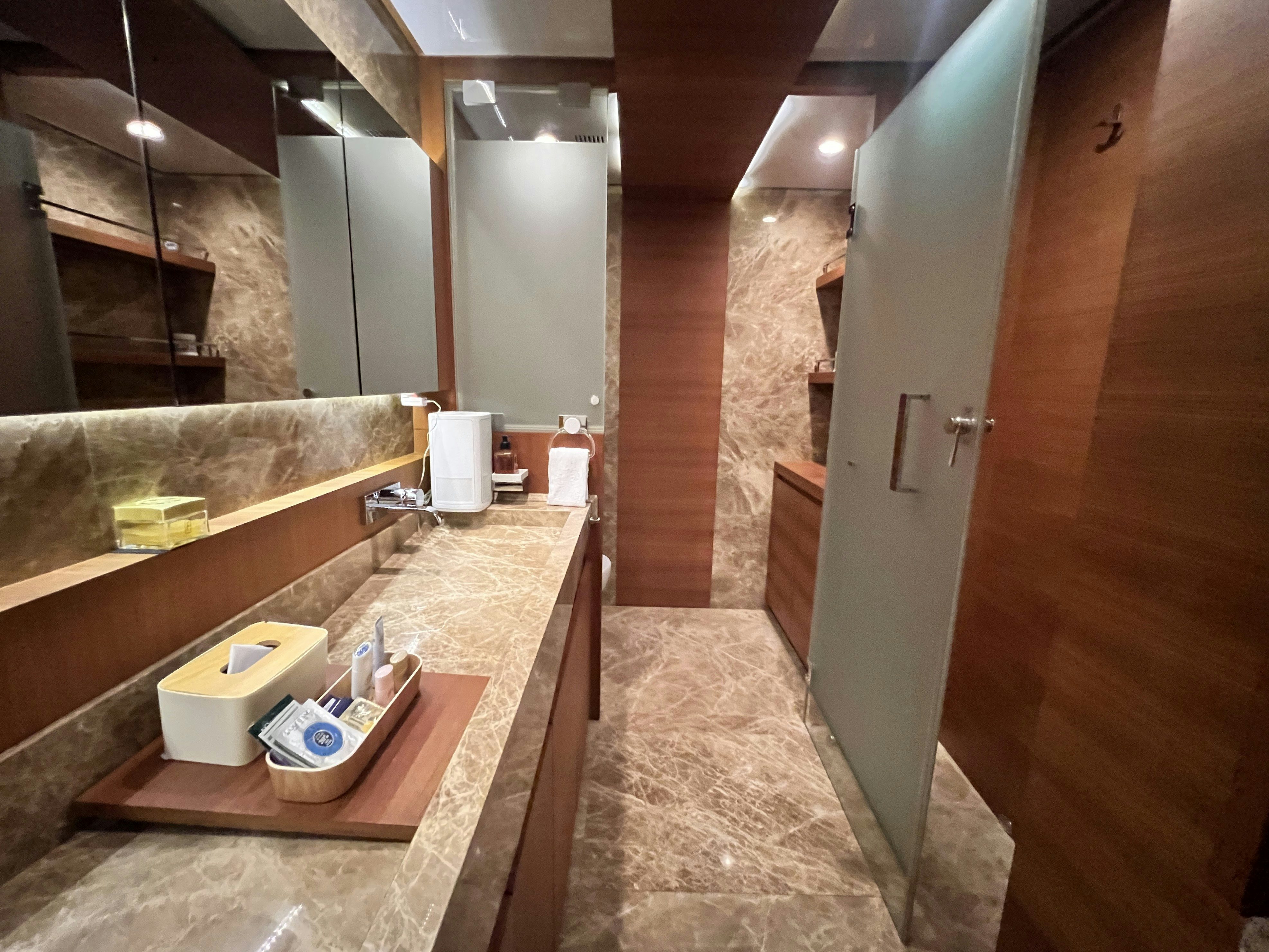 a bathroom with a countertop sink and a mirror aboard SUNRISE Yacht for Sale