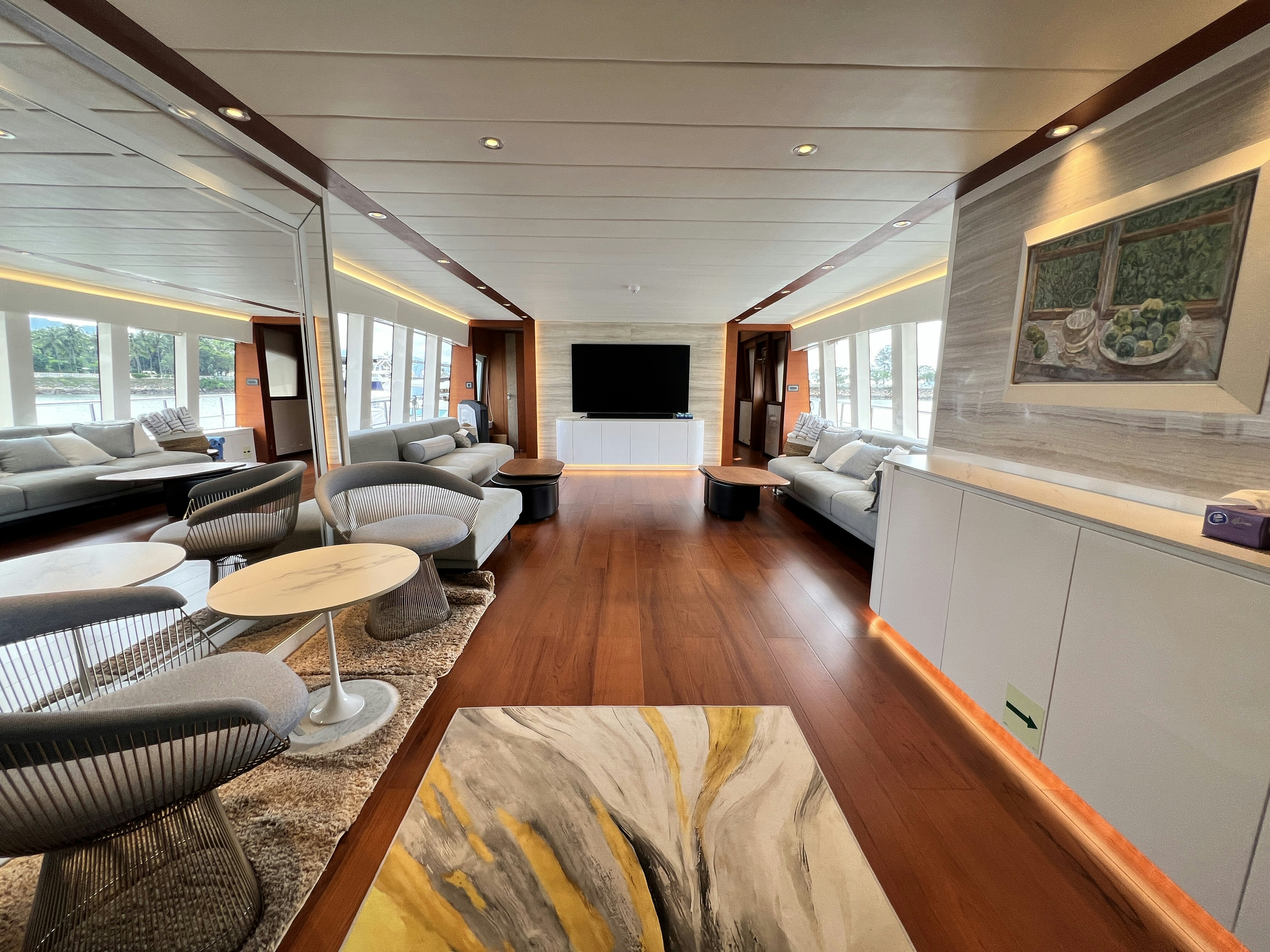 a living room with a wood floor aboard SUNRISE Yacht for Sale