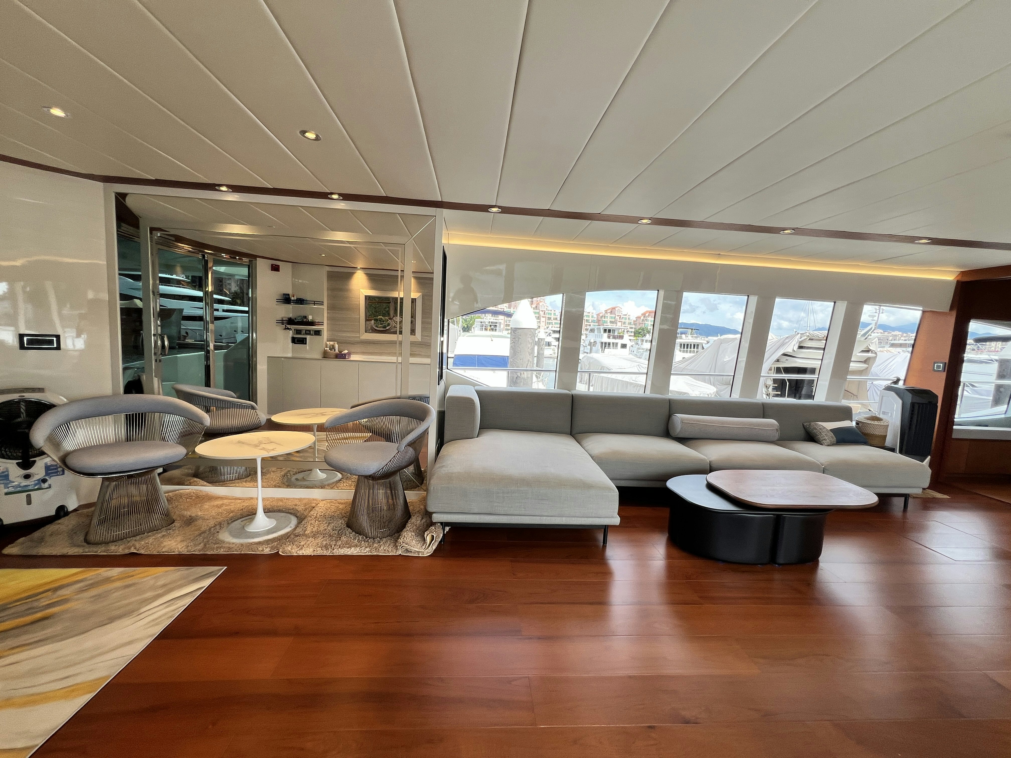 a room with couches and tables aboard SUNRISE Yacht for Sale