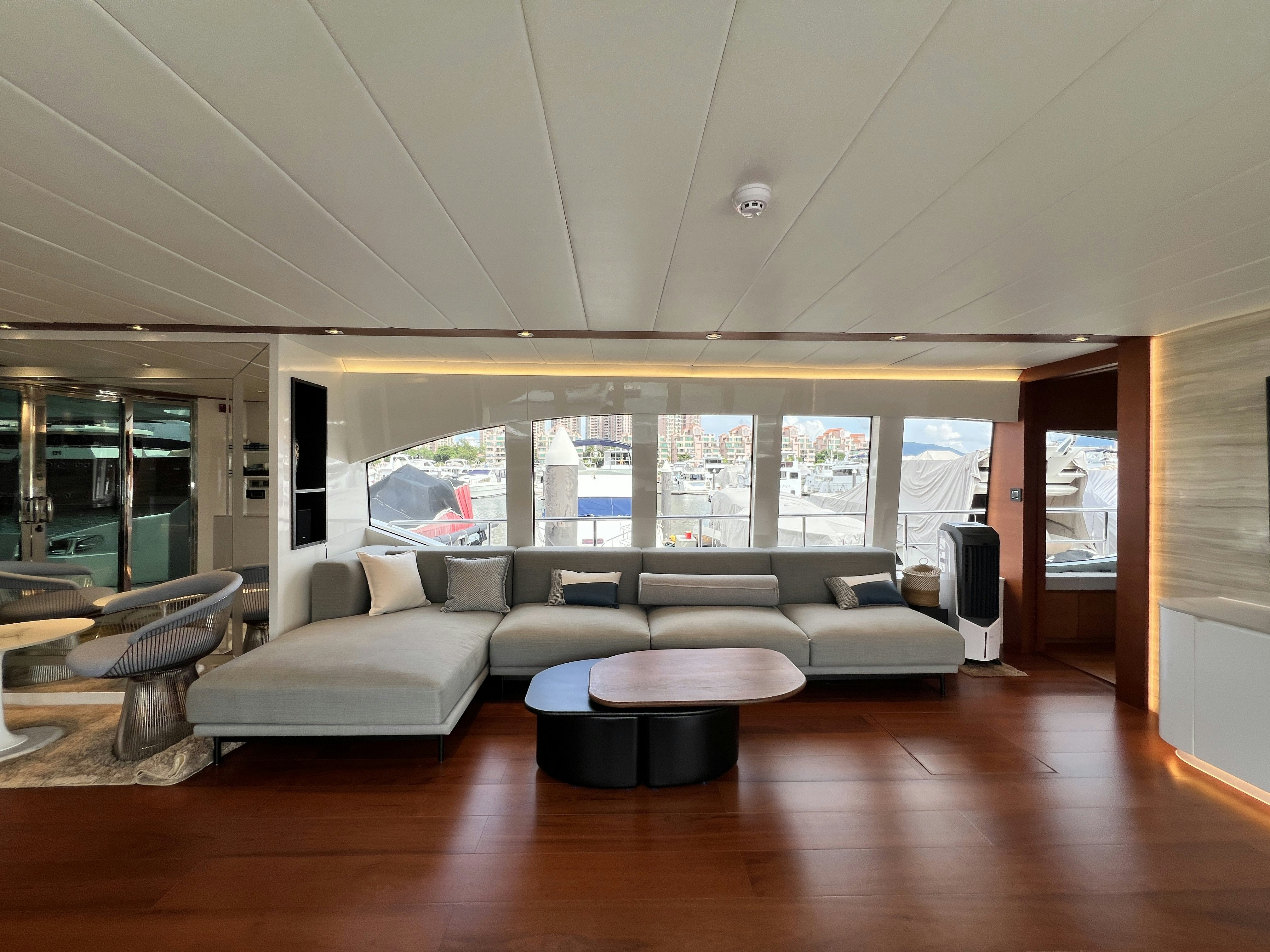 a living room with a large window aboard SUNRISE Yacht for Sale
