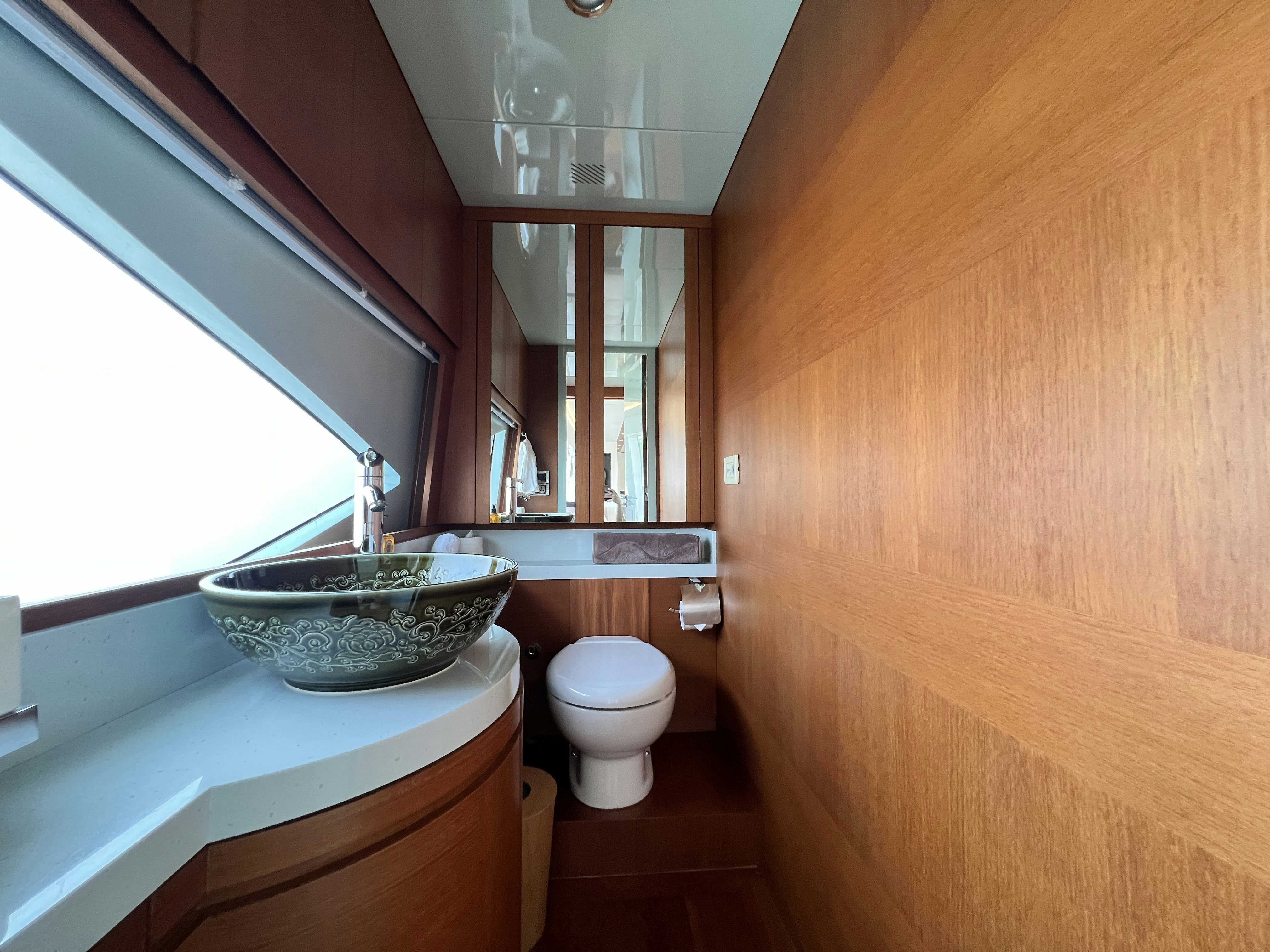 a bathroom with a sink and toilet aboard SUNRISE Yacht for Sale