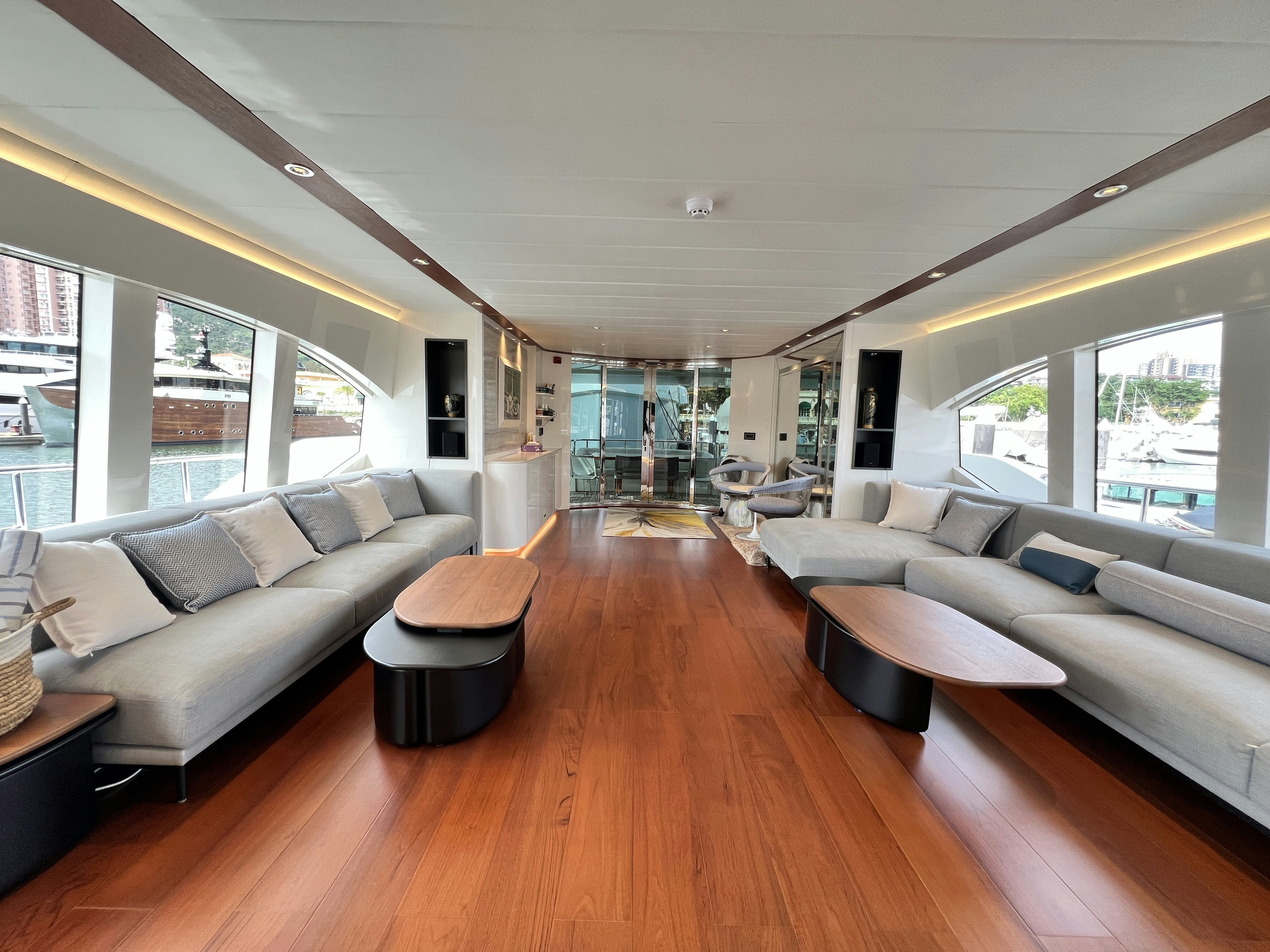 a living room with a wood floor aboard SUNRISE Yacht for Sale