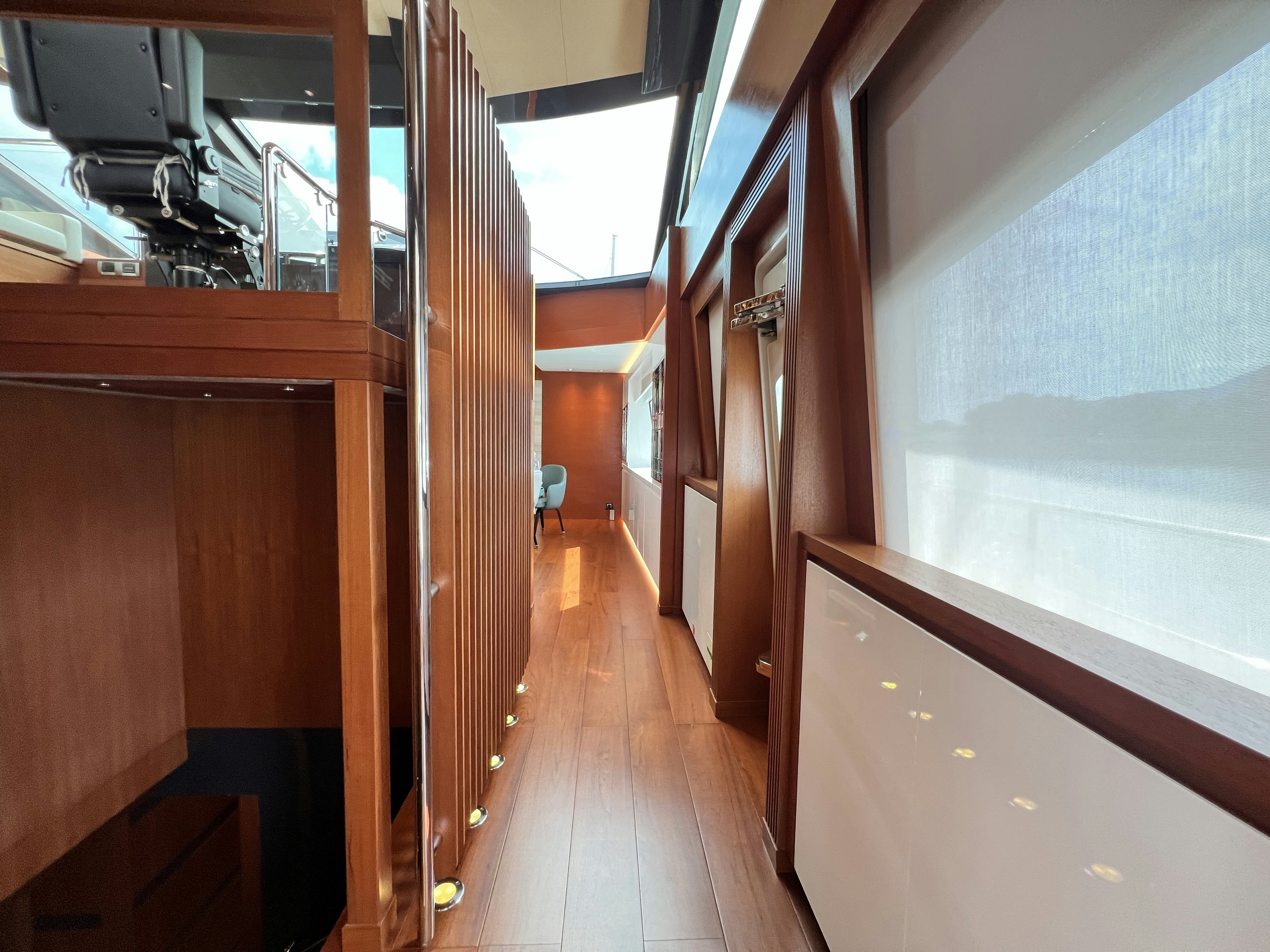 a room with wooden floors and wood cabinets aboard SUNRISE Yacht for Sale