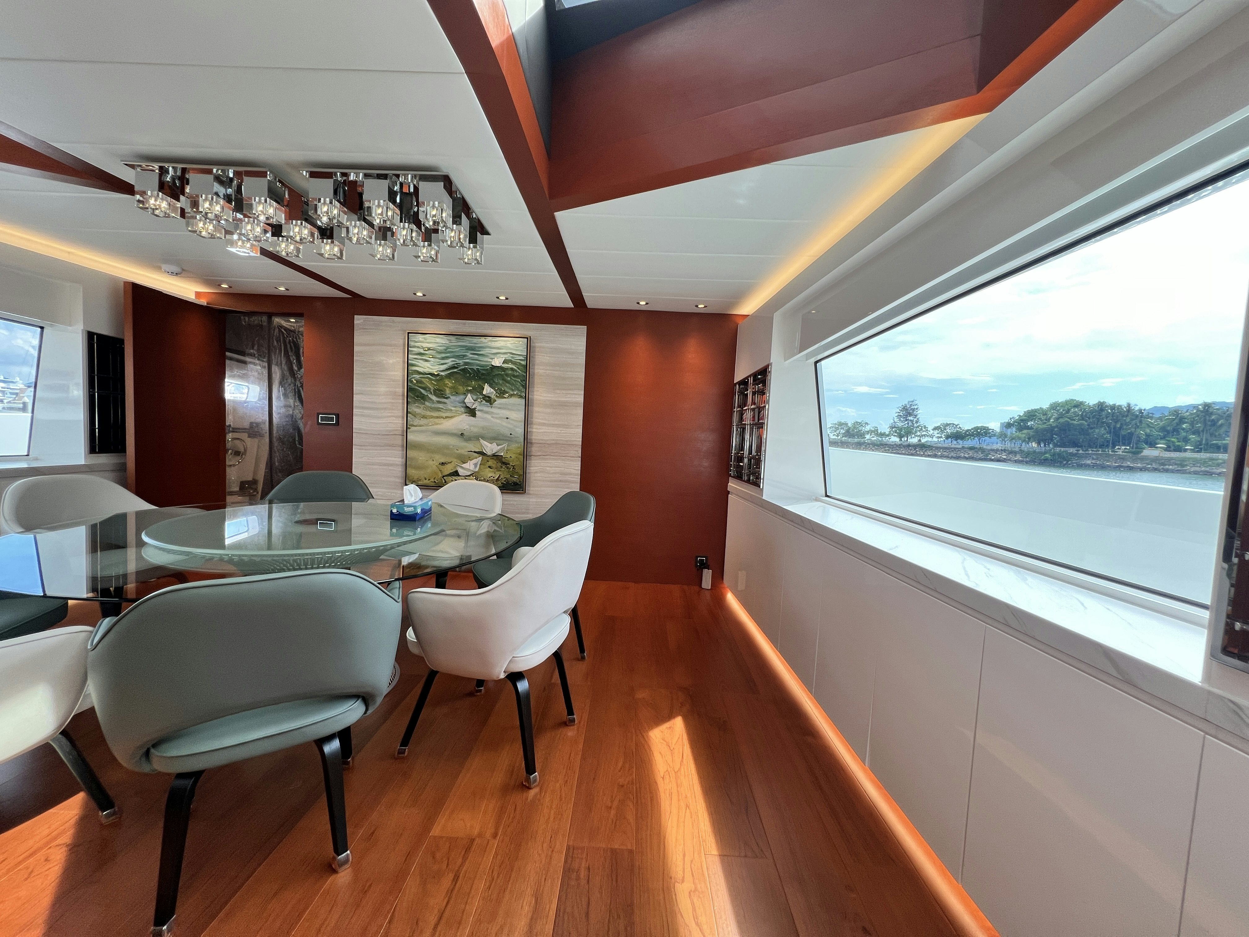 a dining room with a large window aboard SUNRISE Yacht for Sale