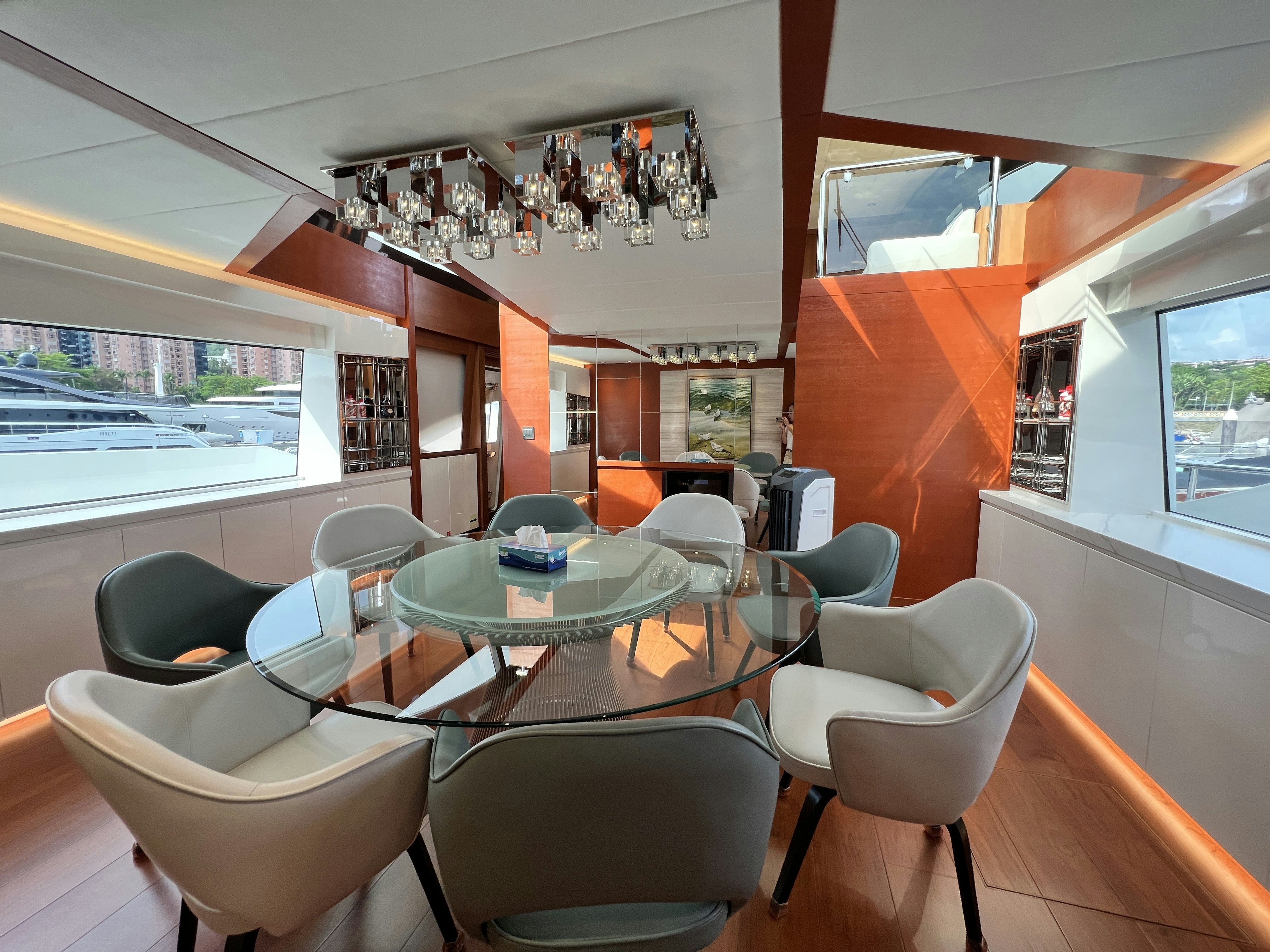 a dining room with a table and chairs aboard SUNRISE Yacht for Sale