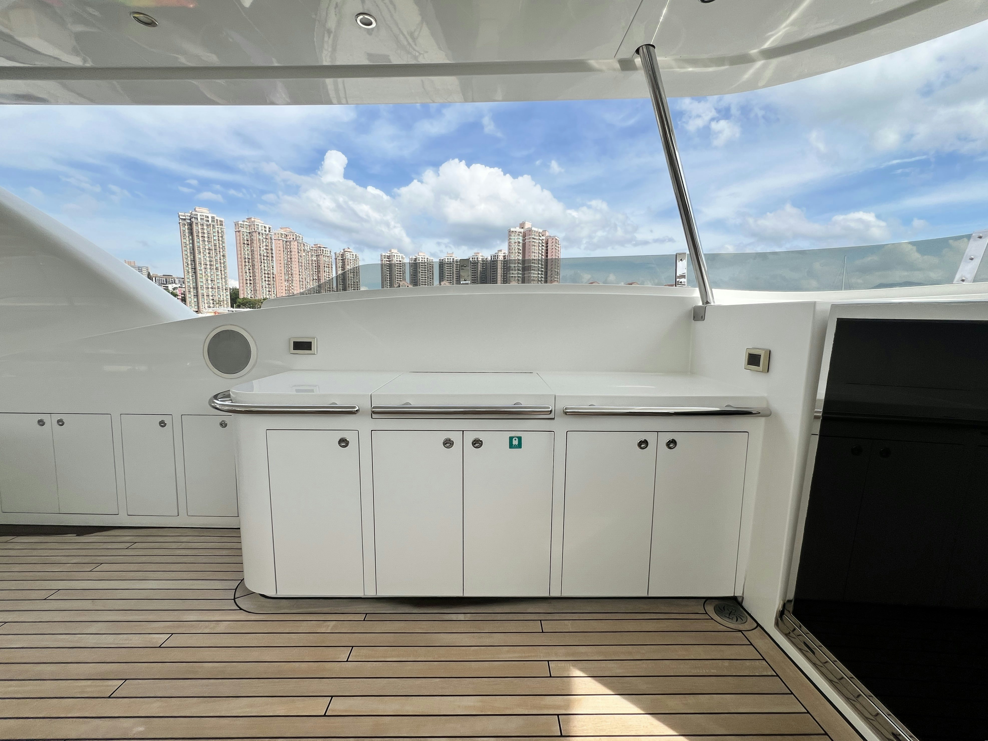 a large kitchen with white cabinets aboard SUNRISE Yacht for Sale