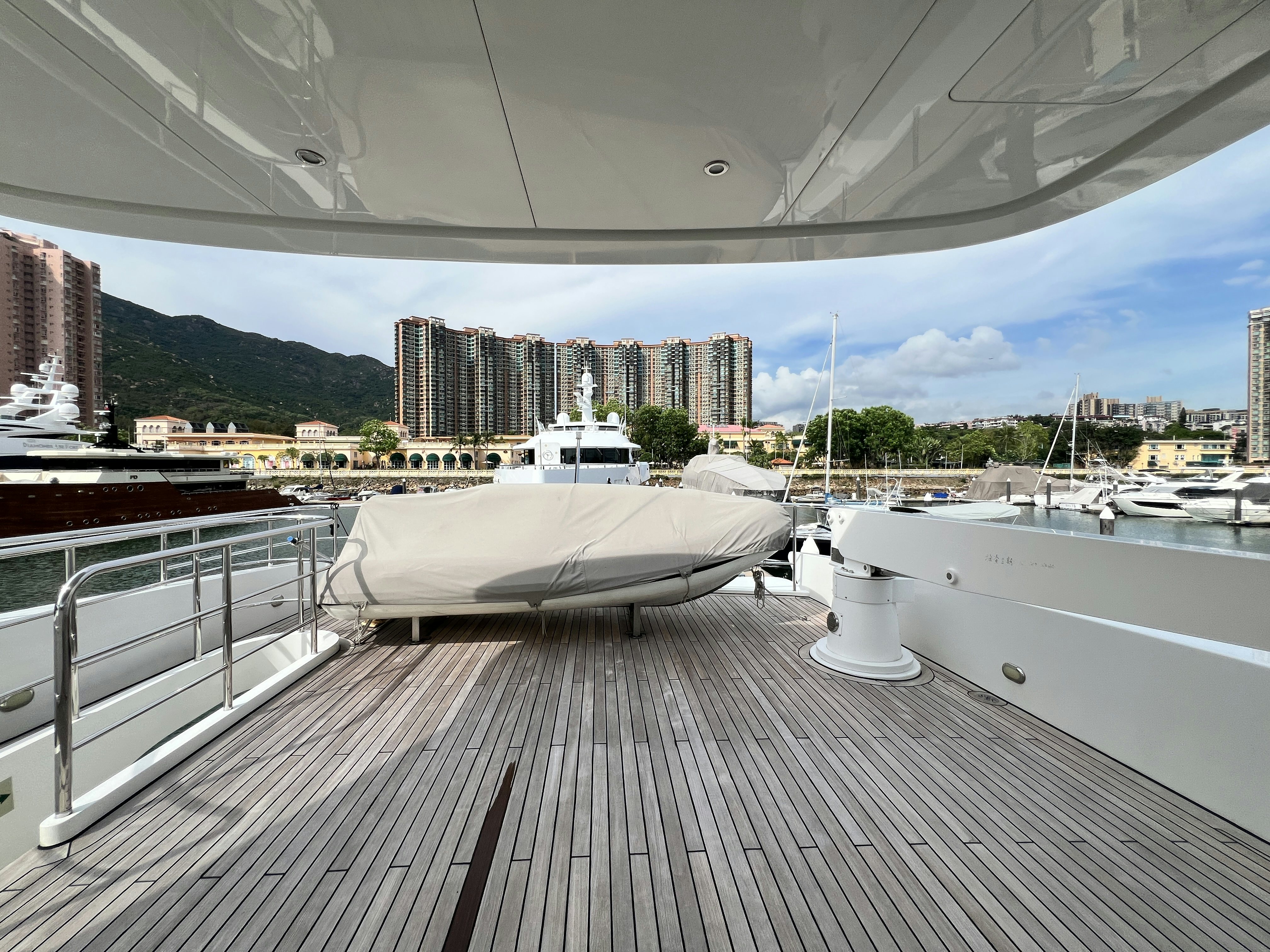 a large white boat sits on a dock aboard SUNRISE Yacht for Sale